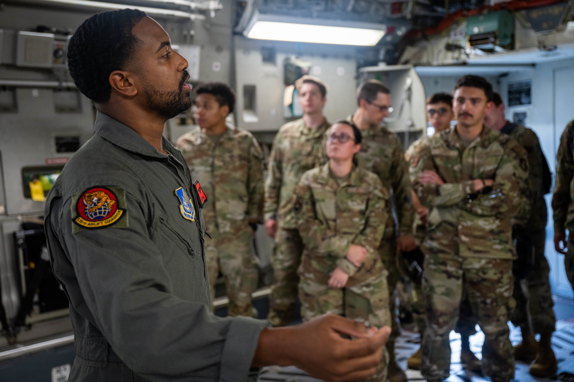 Airmen stand in a group.