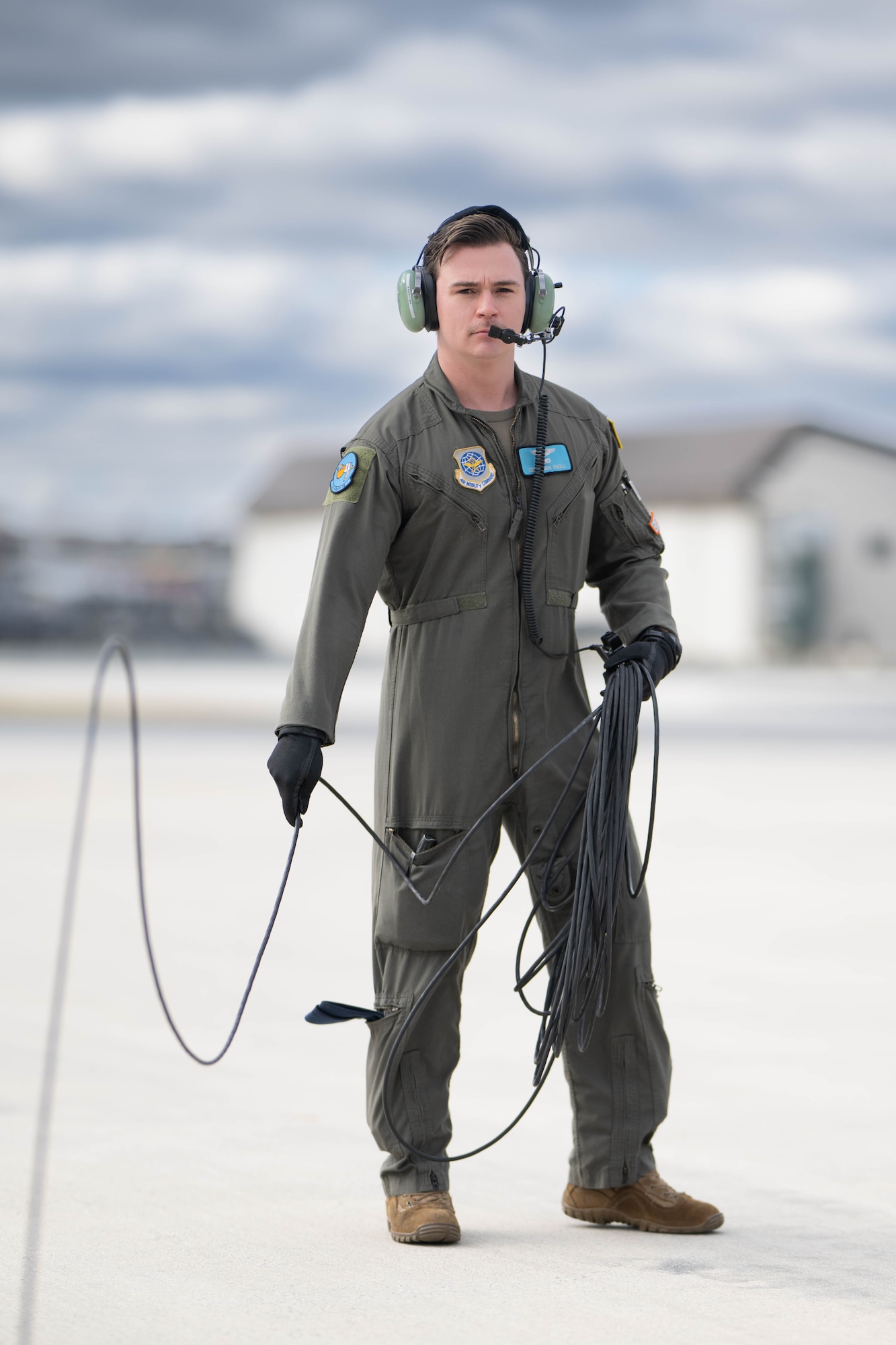 U.S. Air Force Senior Airman Jeff Nolan, 9th Airlift Squadron flight engineer clears flaps on a C-5M Super Galaxy during a Fleet Launch Under Severe Hazards exercise at Dover Air Force Base, Delaware, Jan. 29, 2024. The C-5M FLUSH checklist was designed for an aircrew to launch the Super Galaxy from a ‘no power on’ or ‘dark’ status to an all four engines running posture and taxiing off the parking spot in minimal amount of time for departure in case of an imminent threat. (U.S. Air Force photo by Mauricio Campino)