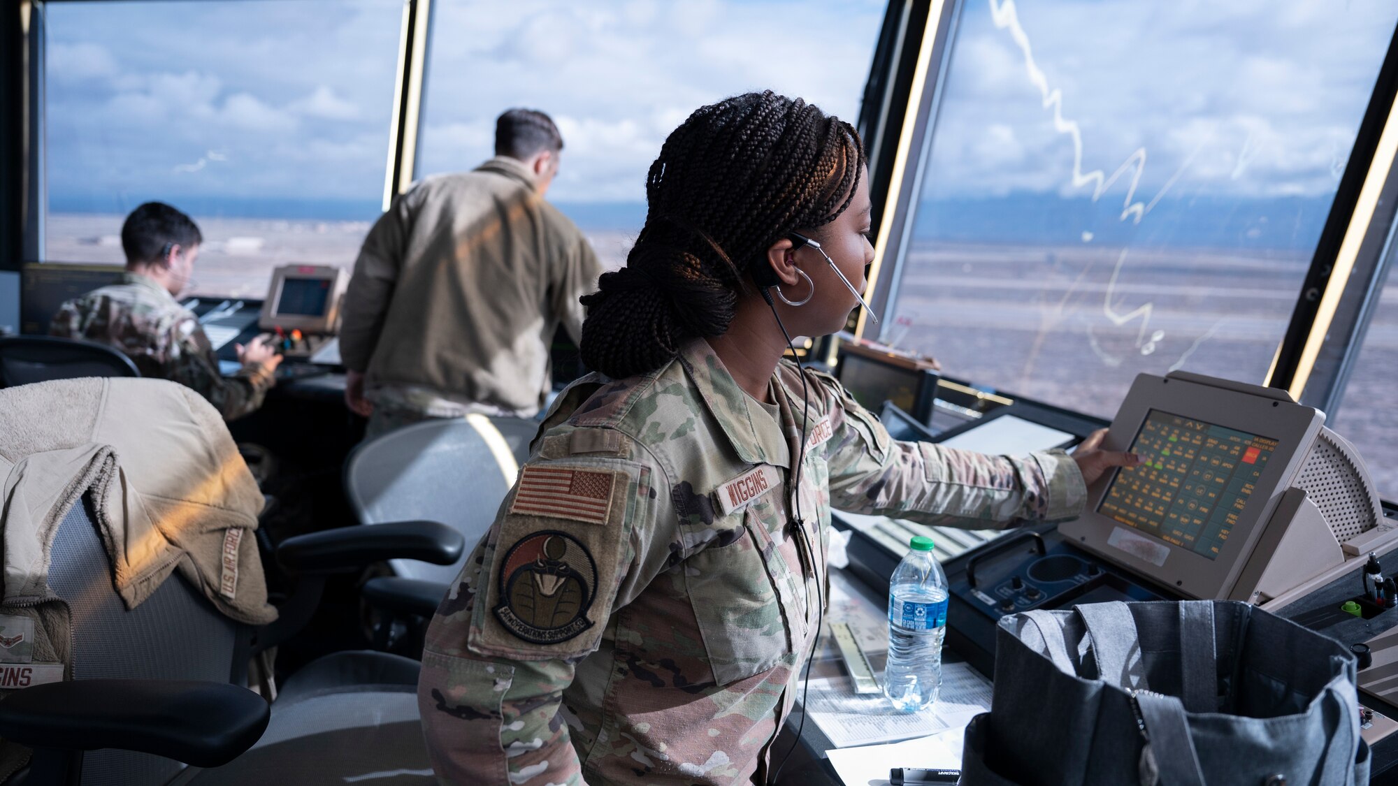 U.S. Air Force Airman 1st Class Indya Wiggins, 54th Operations Support Squadron air traffic controller monitors aircraft movement on the flightline at Holloman Air Force Base, New Mexico, Jan. 24, 2024. ATC’s transmit and listen to multiple frequencies at a time and are responsible for separating and directing aircraft movement during all flightline operations. (U.S. Air Force photo by Airman 1st Class Michelle Ferrari)