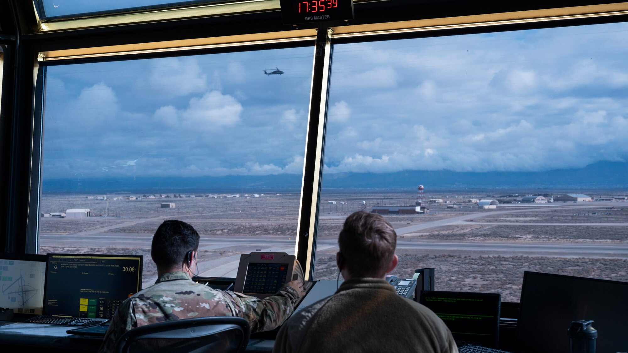 Airmen from the 54th Operations Support Squadron, monitor taxiway activity from the air traffic tower, at Holloman Air Force Base, New Mexico, Jan. 24, 2024. ATC Airmen play a significant role in communicating fight patterns, weather information and are responsible for clearing pilots during take-off and landing. (U.S. Air Force photo by Airman 1st Class Michelle Ferrari)