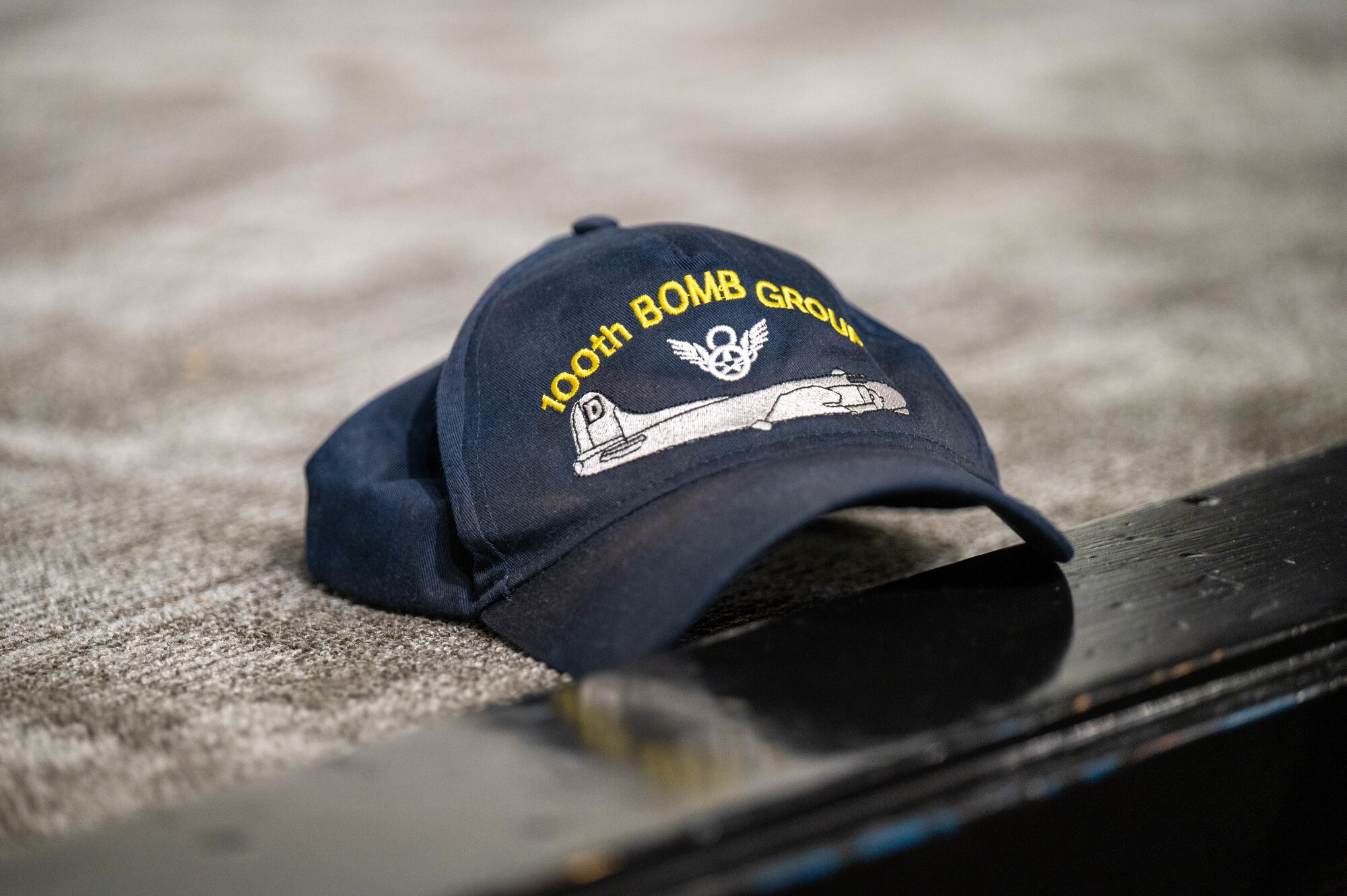 A World War II commemoration hat sits on a stage at the Air Command and Staff College during a special screening of the first two episodes of the series "Masters of the Air”, Maxwell Air Force Base, Alabama, Jan. 26, 2024. ACSC Hosted the families of World War II heroes for a special screening of the first two episodes of "Masters of the Air" allotting active-duty services members the opportunity to talk to the family members of World War II heroes.