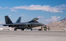 U.S. Air Force Airmen assigned to the 525th Expeditionary Fighter Generation Squadron, Joint Base Elmendorf-Richardson, Alaska, prepare an F-22 Raptor from the 525th Expeditionary Fighter Squadron for takeoff in support of Exercise Bamboo Eagle 24-1 at Nellis Air Force Base, Nevada, Jan. 25, 2024.