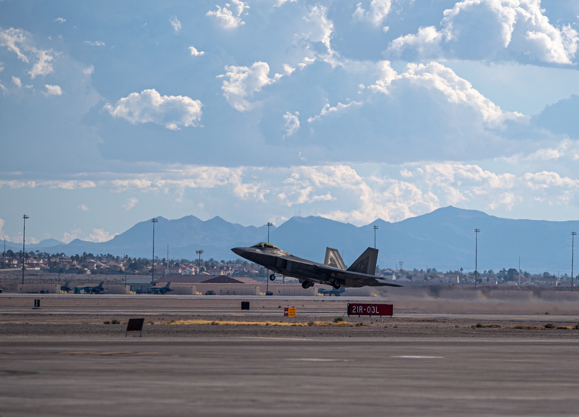 An F-22 Raptor assigned to the 525th Expeditionary Fighter Squadron, Joint Base Elmendorf-Richardson, Alaska, takes off in support of Exercise Bamboo Eagle 24-1 at Nellis Air Force Base, Nevada, Jan. 25, 2024.