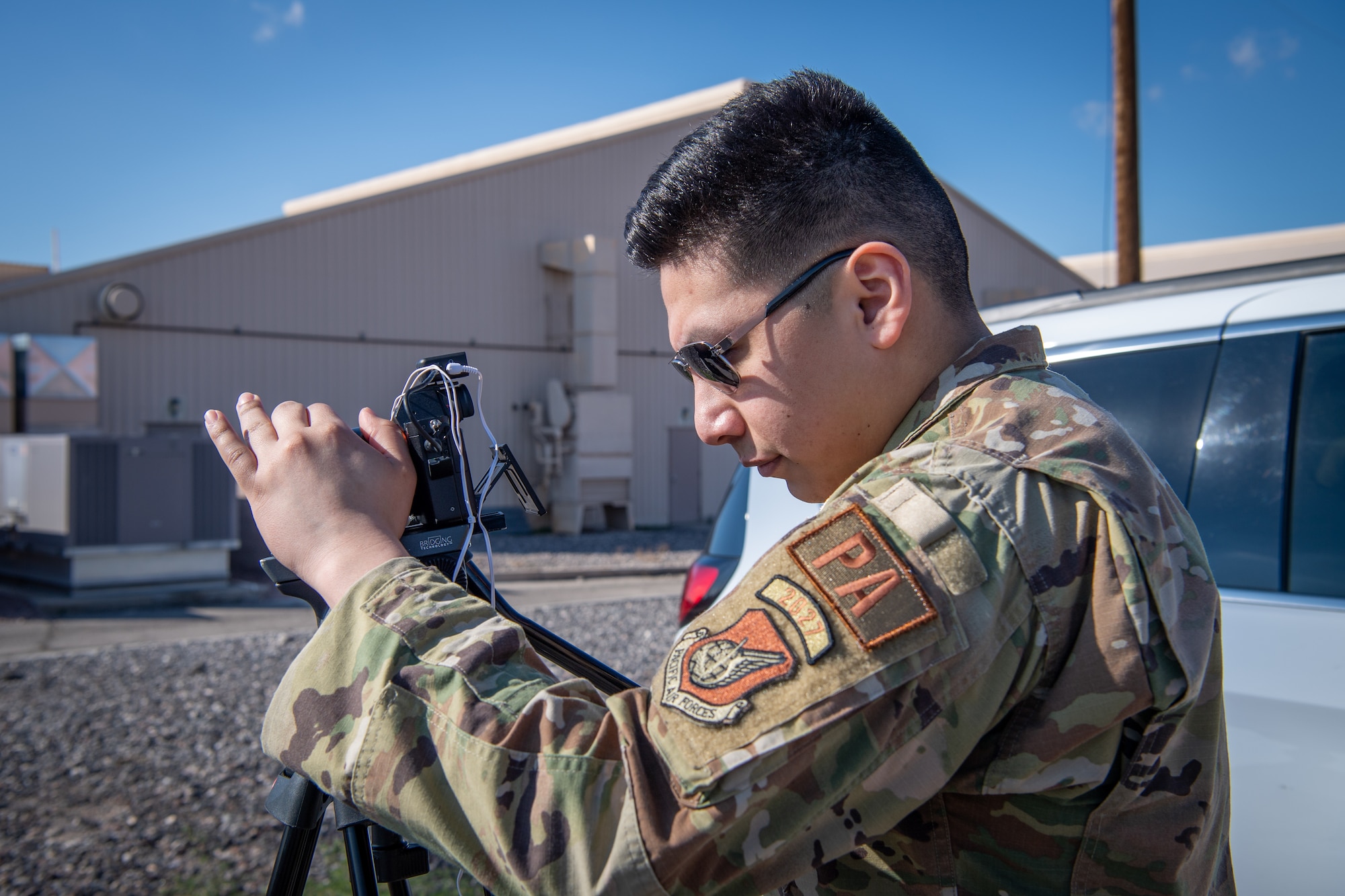 U.S. Air Force Airman First Class Moises Vasquez, 3rd Air Expeditionary Wing Public Affairs journeyman, documents an interview in support of Exercise Bamboo Eagle 24-1 at Nellis Air Force Base, Nevada, Jan. 25 2024.