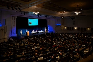 An overview of an auditorium filled with people