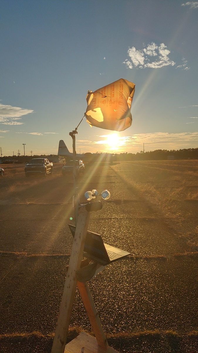 An Air Force Research Laboratory, or AFRL, Scientist and Engineer Demand Force Team, or SEDFT, based in AFRL's Munitions Directorate, constructs a makeshift portable weather station as a solution to simulated damaged or destroyed weather monitoring and reporting technologies at Eglin Air Force Base, Fla., Nov. 9, 2023. A SEDFT is a forward deployable team of scientists and engineers trained and equipped to solve problems, said Lt. Garrett Demeyer, project lead, AFRL Munitions Directorate. (U.S. Air Force photo)
