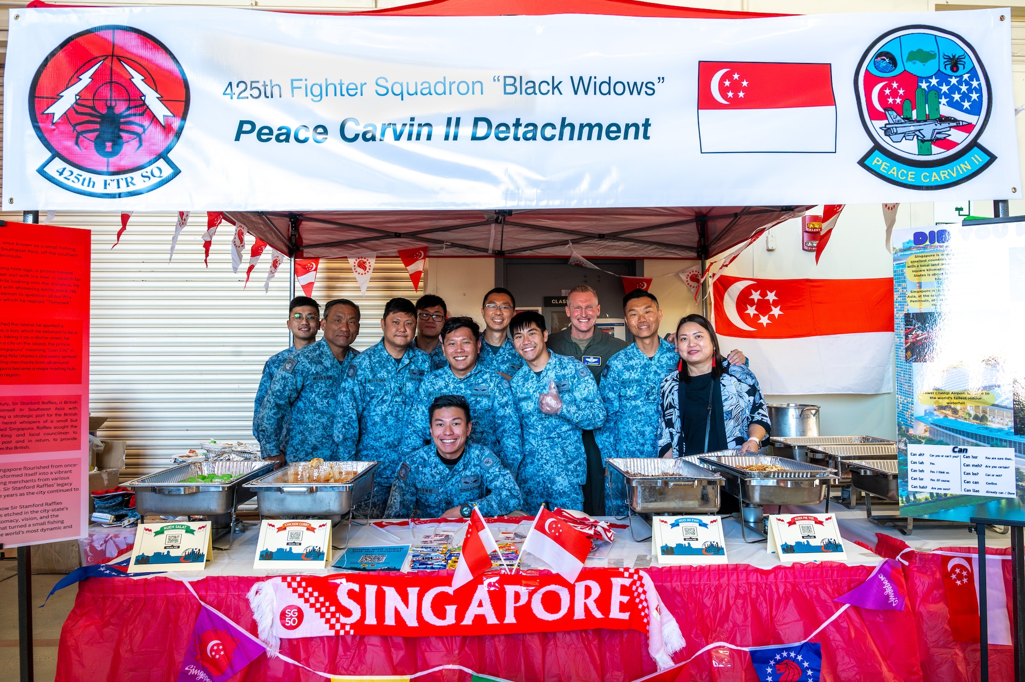U.S. Air Force Brig. Gen. Jason Rueschhoff (center right), 56th Fighter Wing commander, poses with members of Singapore’s Peace Carvin II Detachment during the Luke Air Force Base International Festival 2024, Jan 26, 2024, at Luke AFB, Arizona.