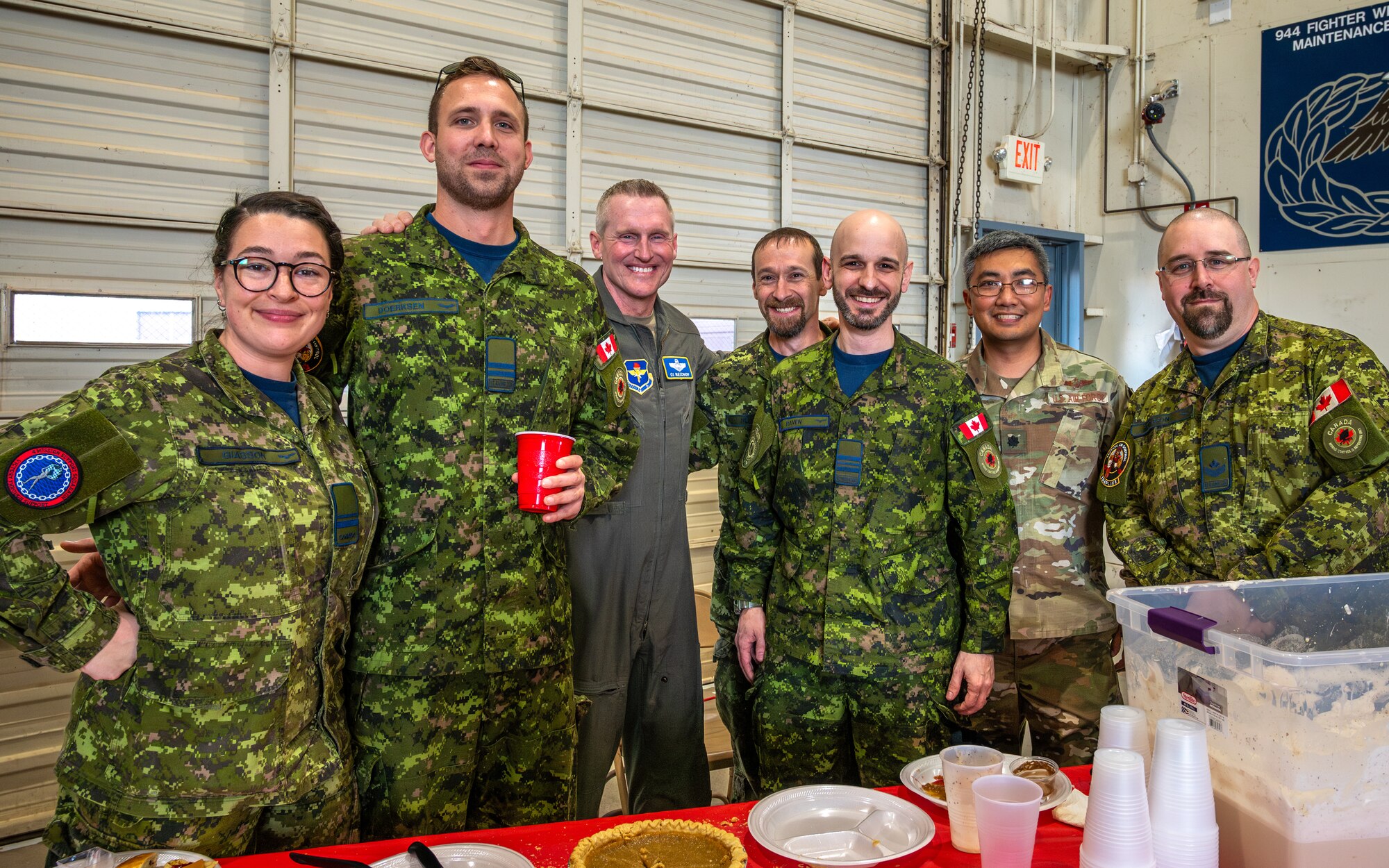 U.S. Air Force Brig. Gen. Jason Rueschhoff (center left), 56th Fighter Wing commander, poses with members of the Royal Canadian Air Force during the Luke Air Force Base International Festival 2024, Jan 26, 2024, at Luke AFB, Arizona.