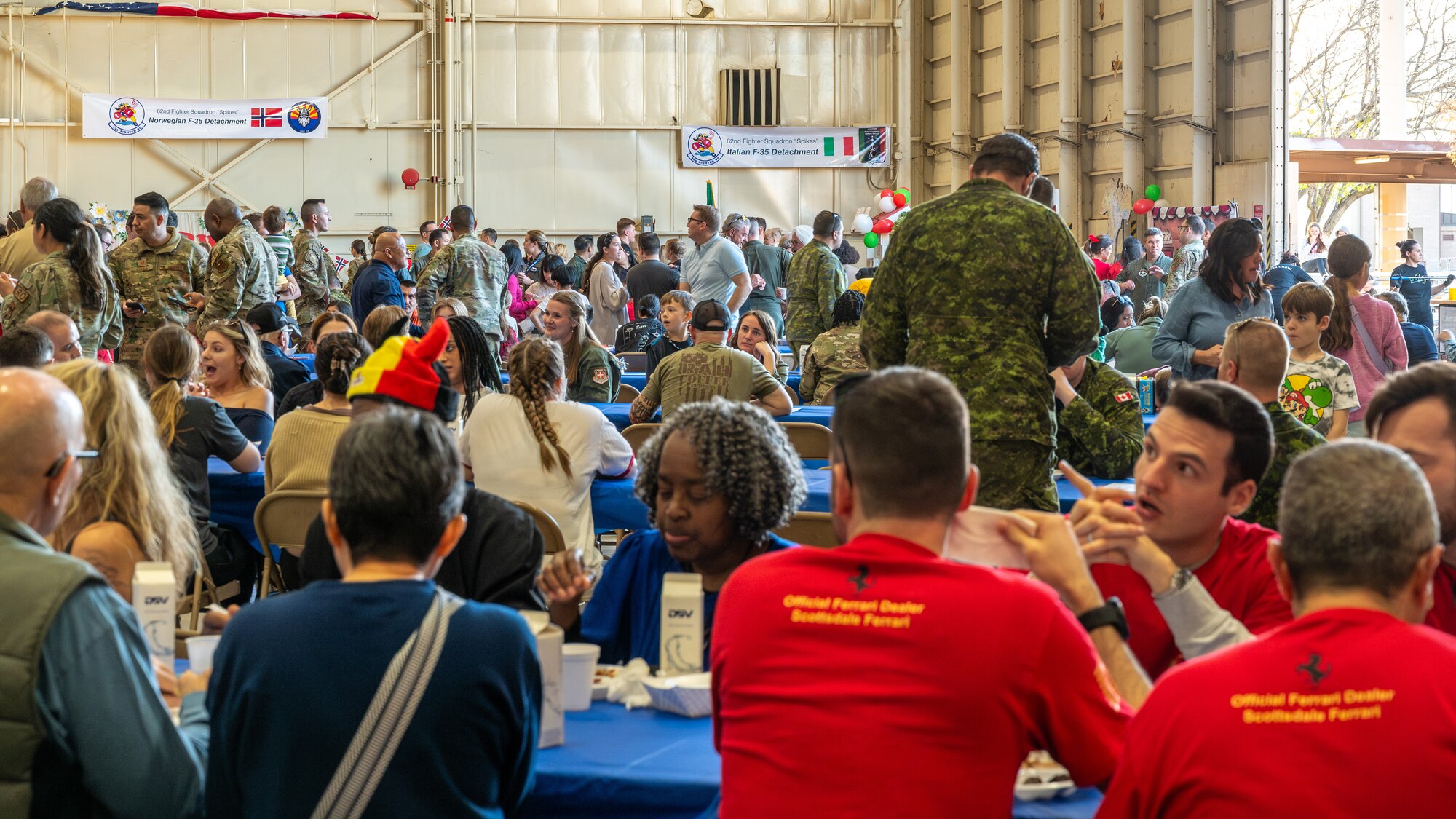 Members of the 56th Fighter wing and their families enjoy food and conversation during the Luke Air Force Base International Festival 2024, Jan 26, 2024, at Luke AFB, Arizona.