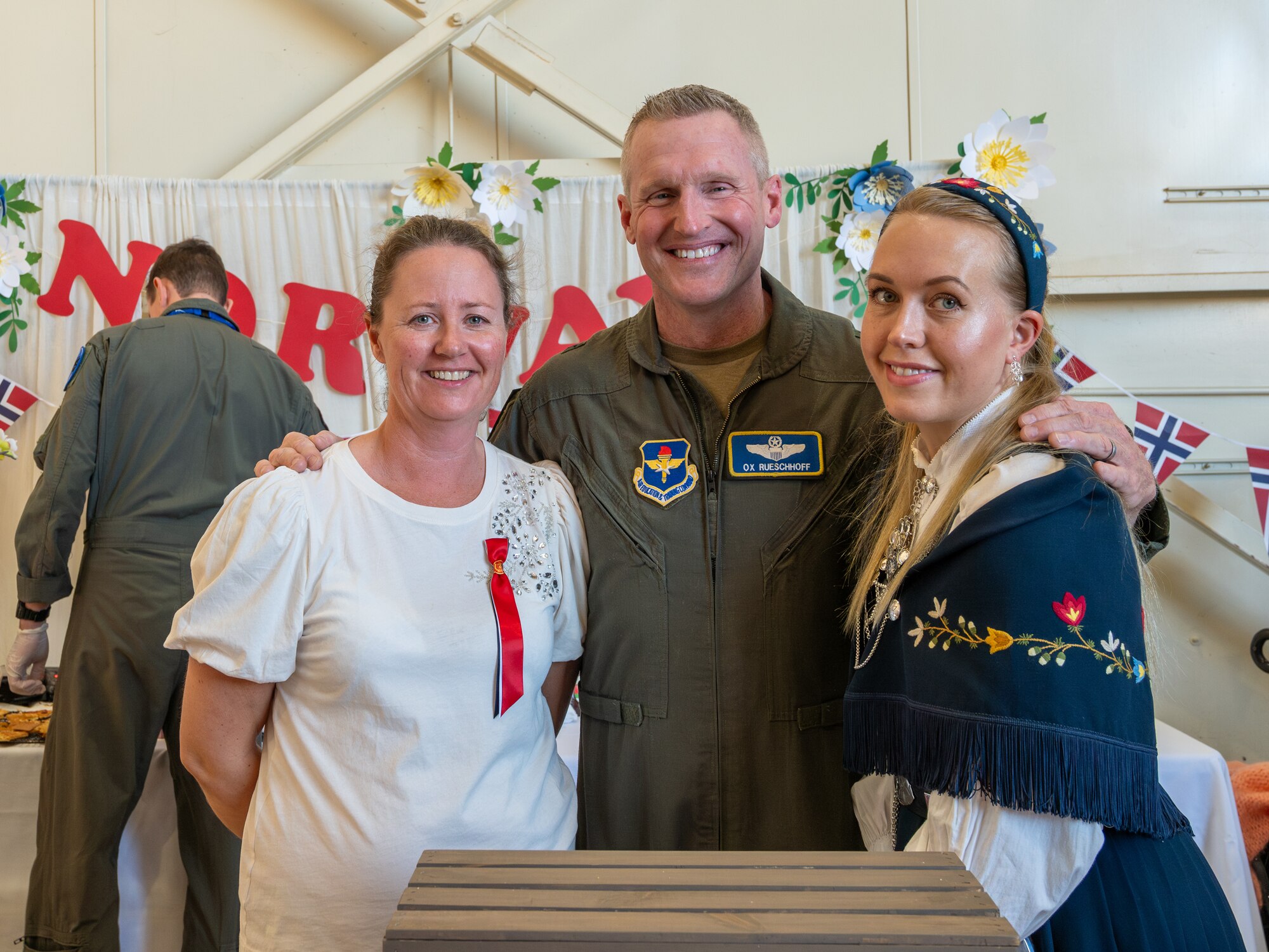 U.S. Air Force Brig. Gen. Jason Rueschhoff (center), 56th Fighter Wing commander, poses with military spouses from Norway’s F-35 Detachment attached to the 62nd Fighter Squadron during the Luke Air Force Base International Festival 2024, Jan 26, 2024, at Luke AFB, Arizona.