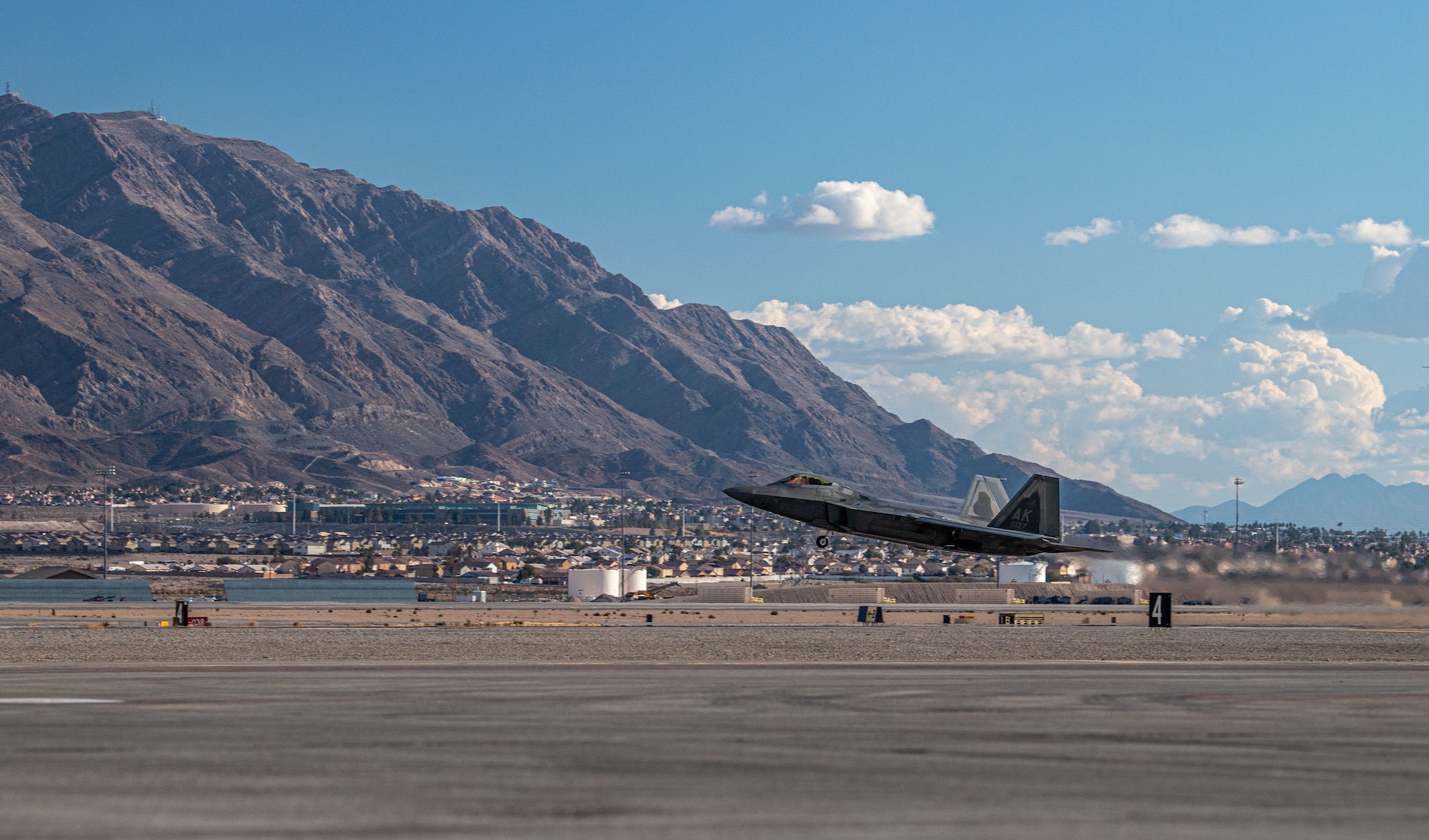 An F-22 Raptor assigned to the 525th Expeditionary Fighter Squadron, Joint Base Elmendorf-Richardson, Alaska, takes off in support of Exercise Bamboo Eagle 24-1 at Nellis Air Force Base, Nevada, Jan. 25, 2024.