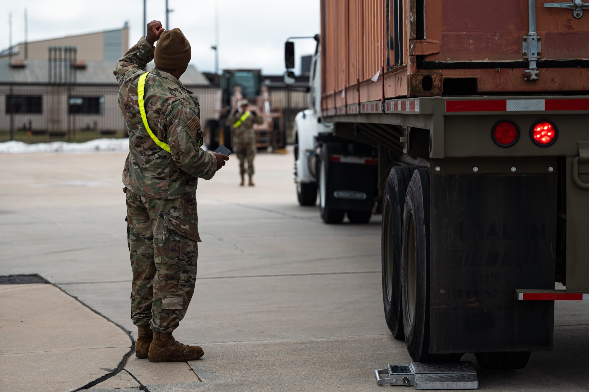 U.S. Air Force Airmen from the 305th Aerial Port Squadron direct a truck full of deployment bags on Joint Base McGuire-Dix-Lakehurst, N.J., Jan. 27, 2024. More than 1,500 New Jersey Army National Guard Soldiers are deploying to support U.S. Central Command’s Combined Joint Task Force-Operation Inherent Resolve. This is the largest deployment of NJARNG Soldiers since 2008. (U.S. Air Force photo by Senior Airman Sergio Avalos)