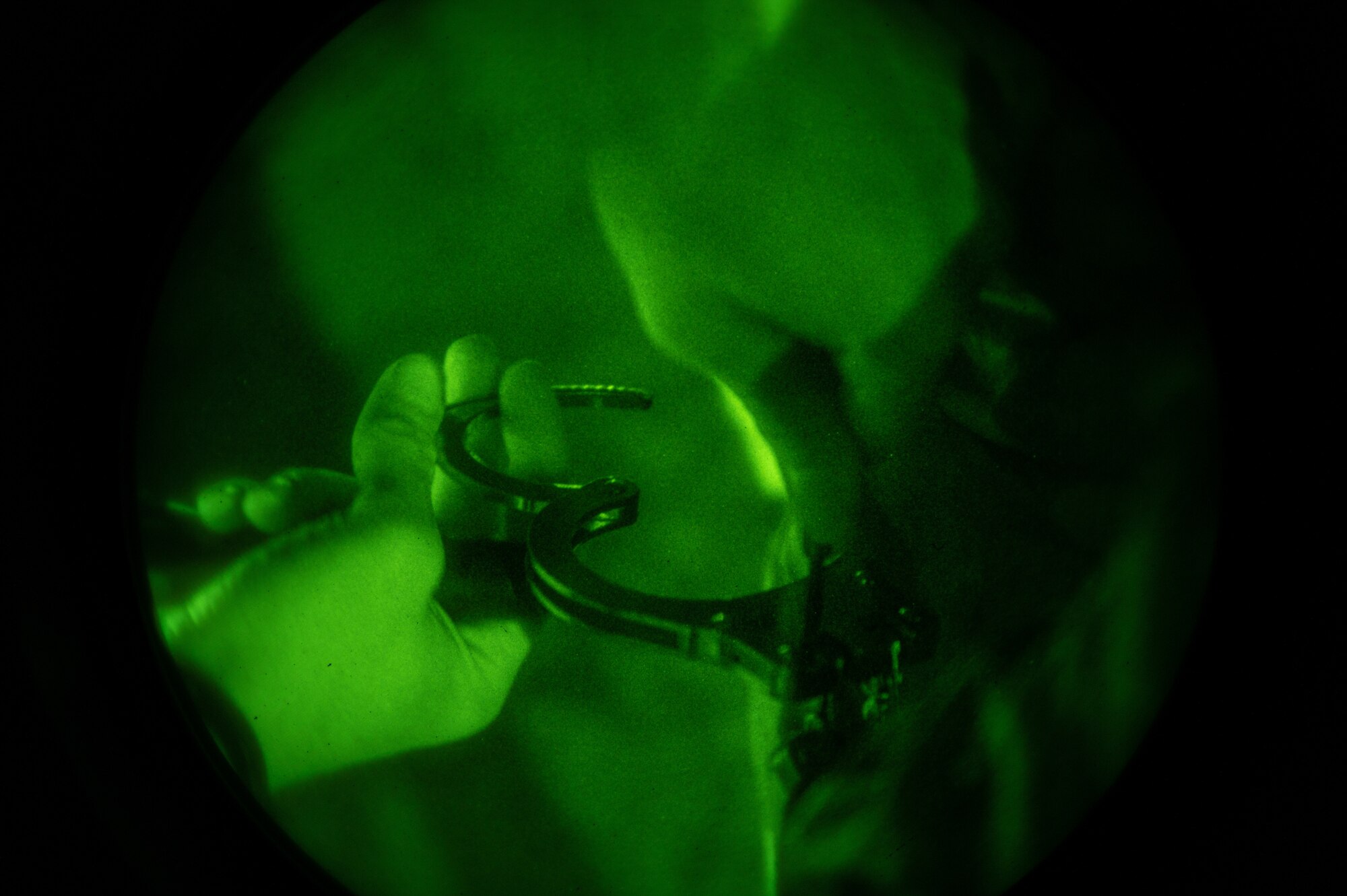U.S. Air Force Airman 1st Class Cody Daly, 51st Security Forces Squadron Defender, removes the handcuffs from an opposing forces member after a simulated security breach during Beverly Midnight 24-1 at Osan Air Base, Republic of Korea, Jan. 30, 2024. BM24-1 is a routine training event that tests the military capabilities across the peninsula, allowing combined and joint training at both the operational and tactical levels. The Airmen of the 51st Fighter Wing continuously train to maintain the high level of full-spectrum readiness required to execute the mission proficiently and effectively. (U.S. Air Force photo by Airman 1st Class Chase Verzaal)