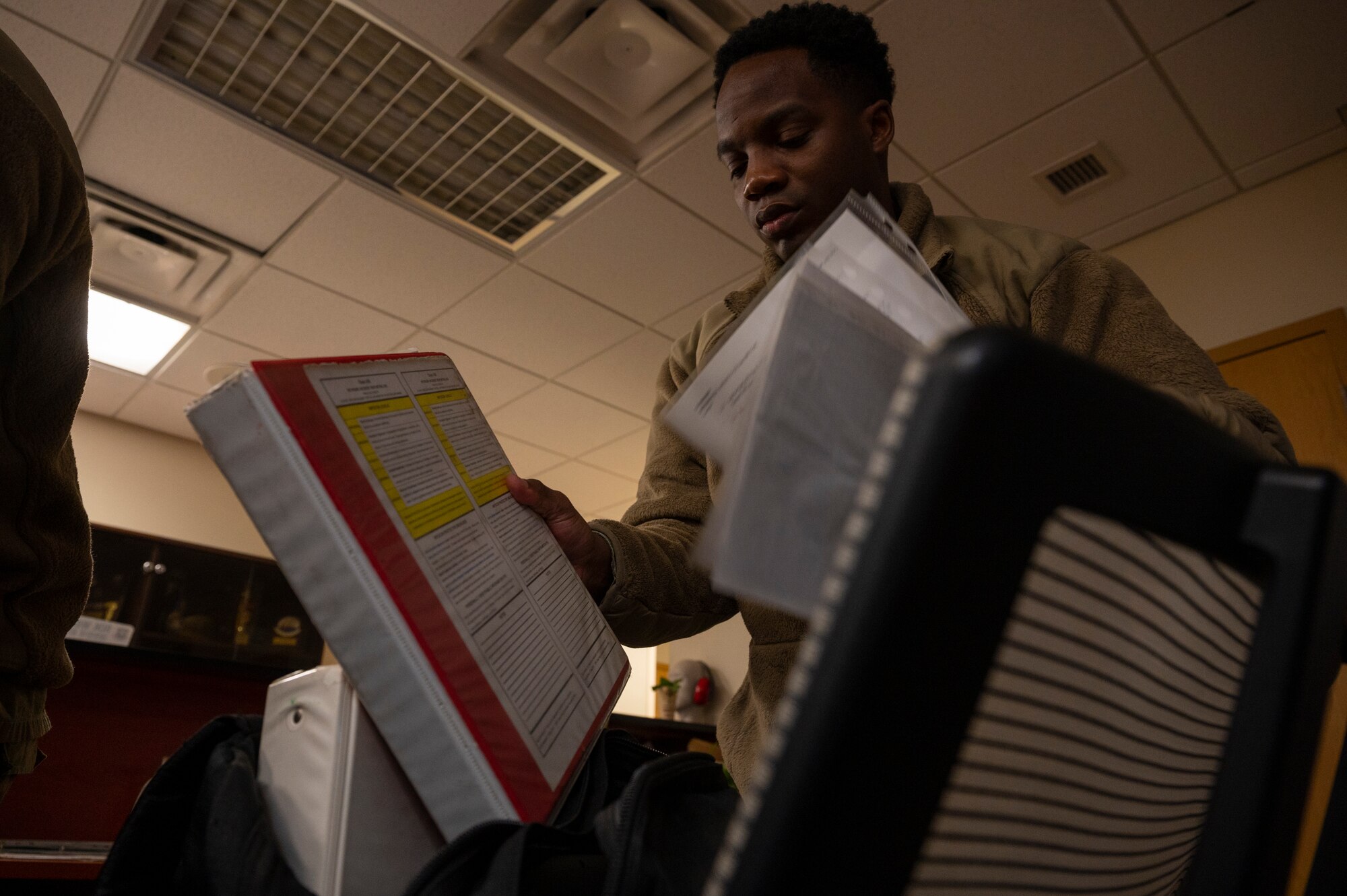 U.S. Air Force Staff Sgt. Jabari Freeman, 51st Operations Support Squadron weather technician, packs a bag to relocate to an alternate duty location during Beverly Midnight 24-1 at Osan Air Base, Republic of Korea, Jan. 29, 2024. BM24-1 is a routine training event that tests the military capabilities across the peninsula, allowing combined and joint training at both the operational and tactical levels. (U.S. Air Force photo by Senior Airman Kaitlin Castillo)