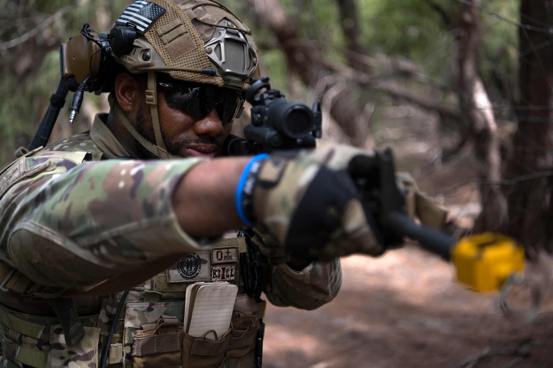 U.S. Air Force Airman 1st Class Tyrone Alexander, a security forces journeyman with the 123rd Contingency Response Group, Kentucky Air National Guard, aims his weapon during air base ground defense training at Muñiz Air National Guard Base, Carolina, Puerto Rico, Sept. 21, 2023. During the training, Airmen reinforced air base ground defense skills utilized during contingency response operations in contested environments by practicing radio communications, warning and operation orders, vehicle searches, vehicle take-downs, close-quarter battle, and small team tactics. (U.S. Air National Guard photo by Master Sgt. Rafael D. Rosa)