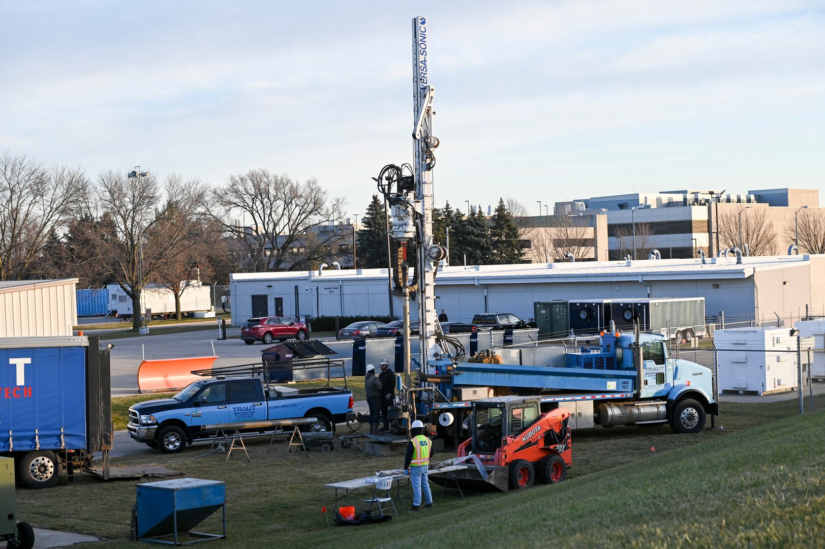 Employees of Traut Companies and a geologist with EA Engineering, Science, and Technology, Inc. install a permanent monitoring well during a remedial investigation into the presence of Per- and Polyfluoroalkyl substances at Truax Field in Madison, Wisconsin, Dec. 13, 2023. The investigation marks the second major step in the Environmental Protection Agency’s Comprehensive Environmental Response, Compensation, and Liability Act process which will guide the mitigation of PFAS compounds on and around the Air National Guard installation. (U.S. Air National Guard photo by Isabella Jansen)