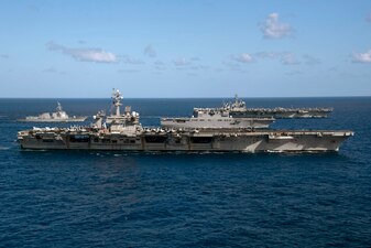 USS Carl Vinson (CVN 70), USS Theodore Roosevelt (CVN 71), USS Daniel K. Inouye (DDG 118) and JS Ise (DDH 182) during Multi-Large Deck Event.