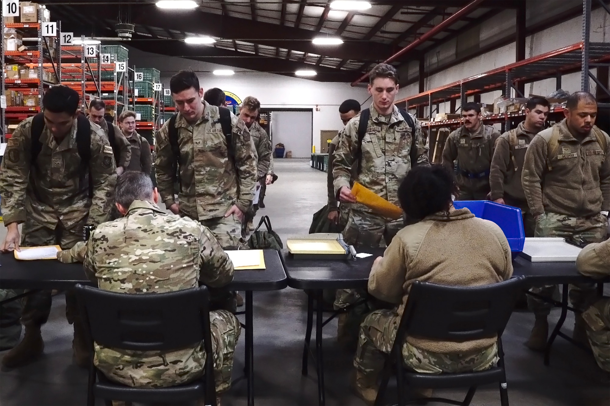 A photo of Airman going through a pre-deployment line.