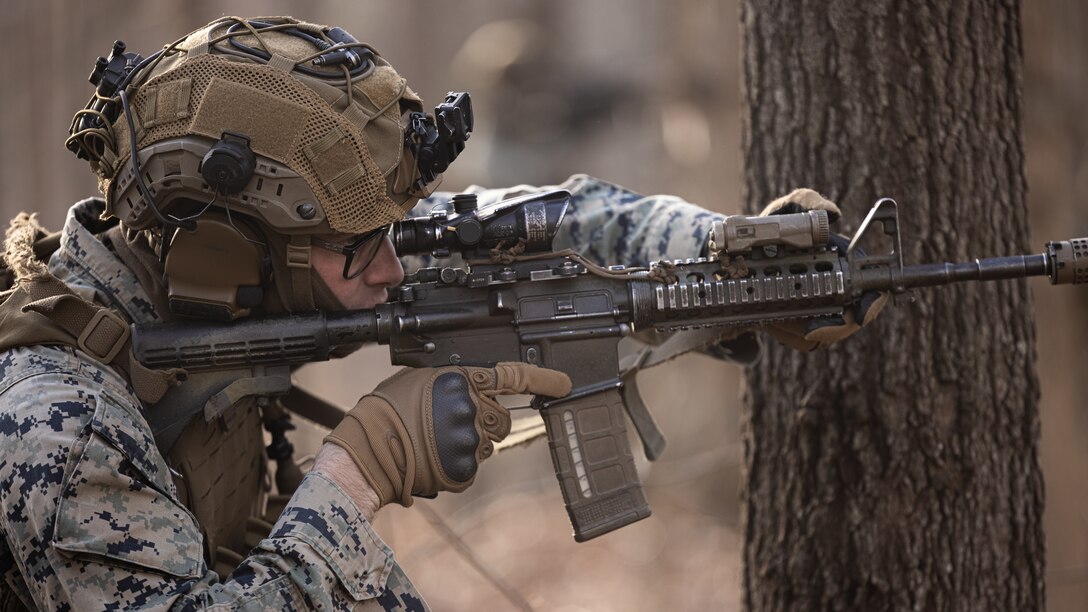 A U.S. Marine with Alpha Company, Battalion Landing Team 1/8, 24th Marine Expeditionary Unit, conducts a simulated raid during military operations in urban terrain as part of Realistic Urban Training on Fort Barfoot, Virginia, Jan. 18, 2024. RUT provides the 24th MEU the opportunity to operate in unfamiliar environments, integrate the units of the Marine Air Ground Task Force, and train towards being designated as special operations capable.