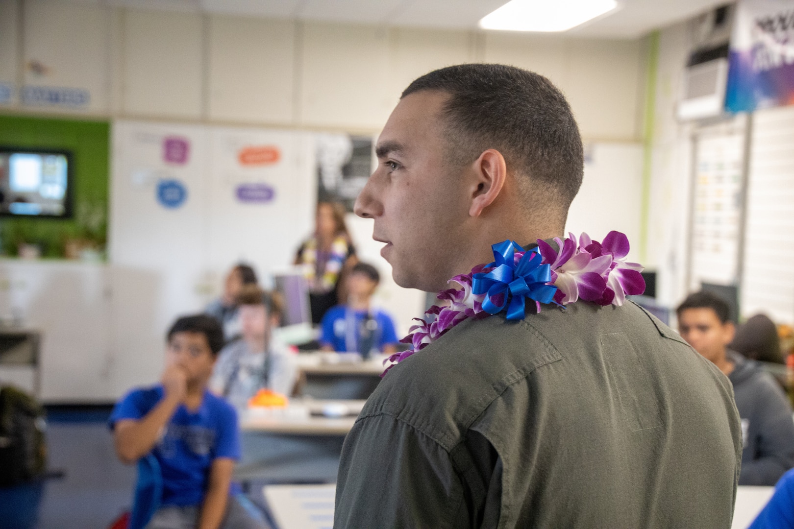 U.S. Marine Corps Cpl. Jacob Vasek and 1st Lt. Andrew Tilden with Marine Unmanned Aerial Vehicle Squadron (VMU) 3, Marine Aircraft Group 24, 1st Marine Aircraft Wing, educate students about the MQ-9A MUX/MALE at Aliamanu Middle School, Hawaii, Jan. 26, 2024. Students learned about MQ-9A capabilities and aviation career fields in the Marine Corps. (U.S. Marine Corps photo by Lance Cpl. Logan Beeney)
