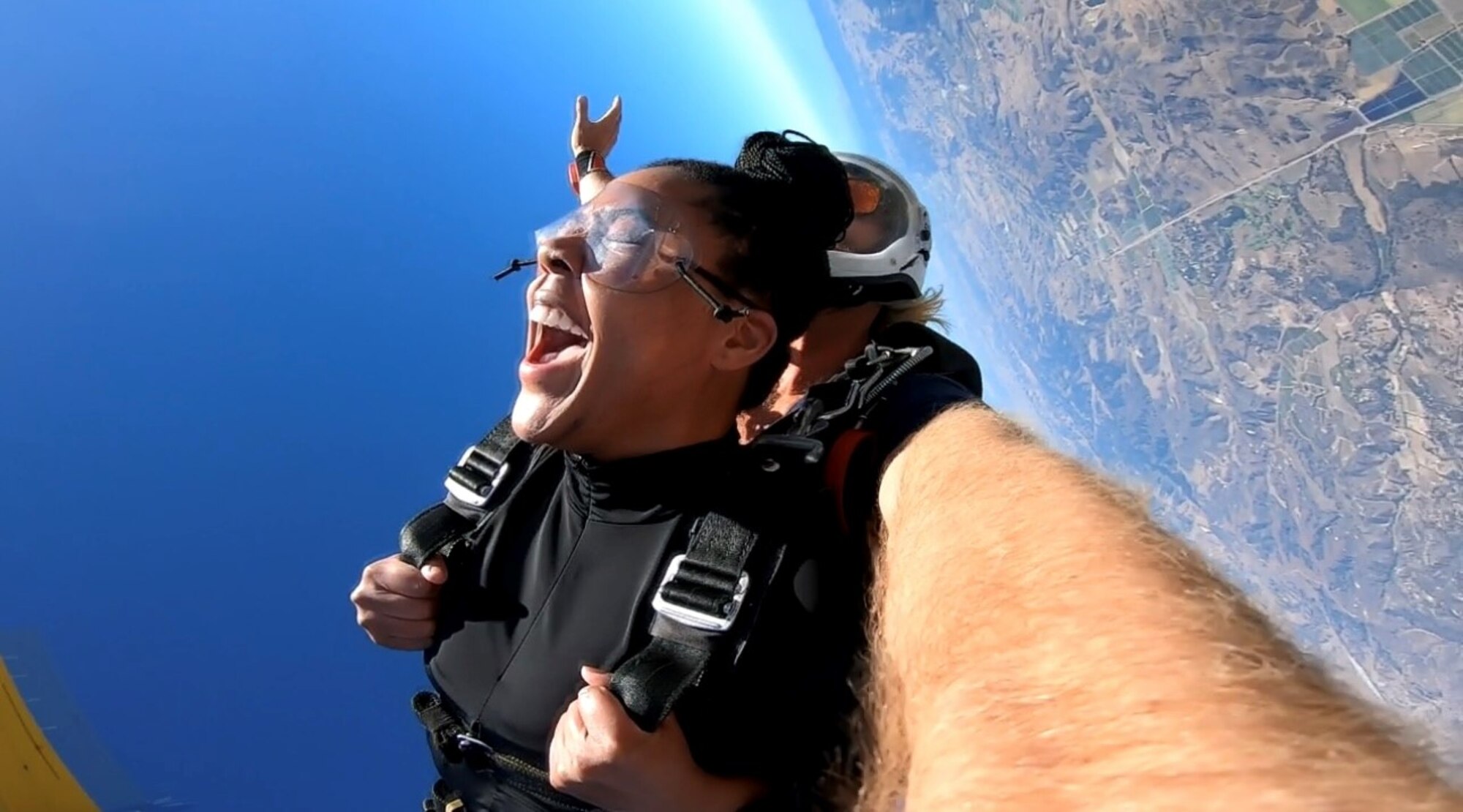 U.S. Space Force Sgt. Kendra Walker holds on tight during a skydive jump over Lompoc, California. A self-proclaimed adrenaline junky, Walker hopes to become a licensed skydiver, allowing her to complete jumps solo. (Courtesy photo)
