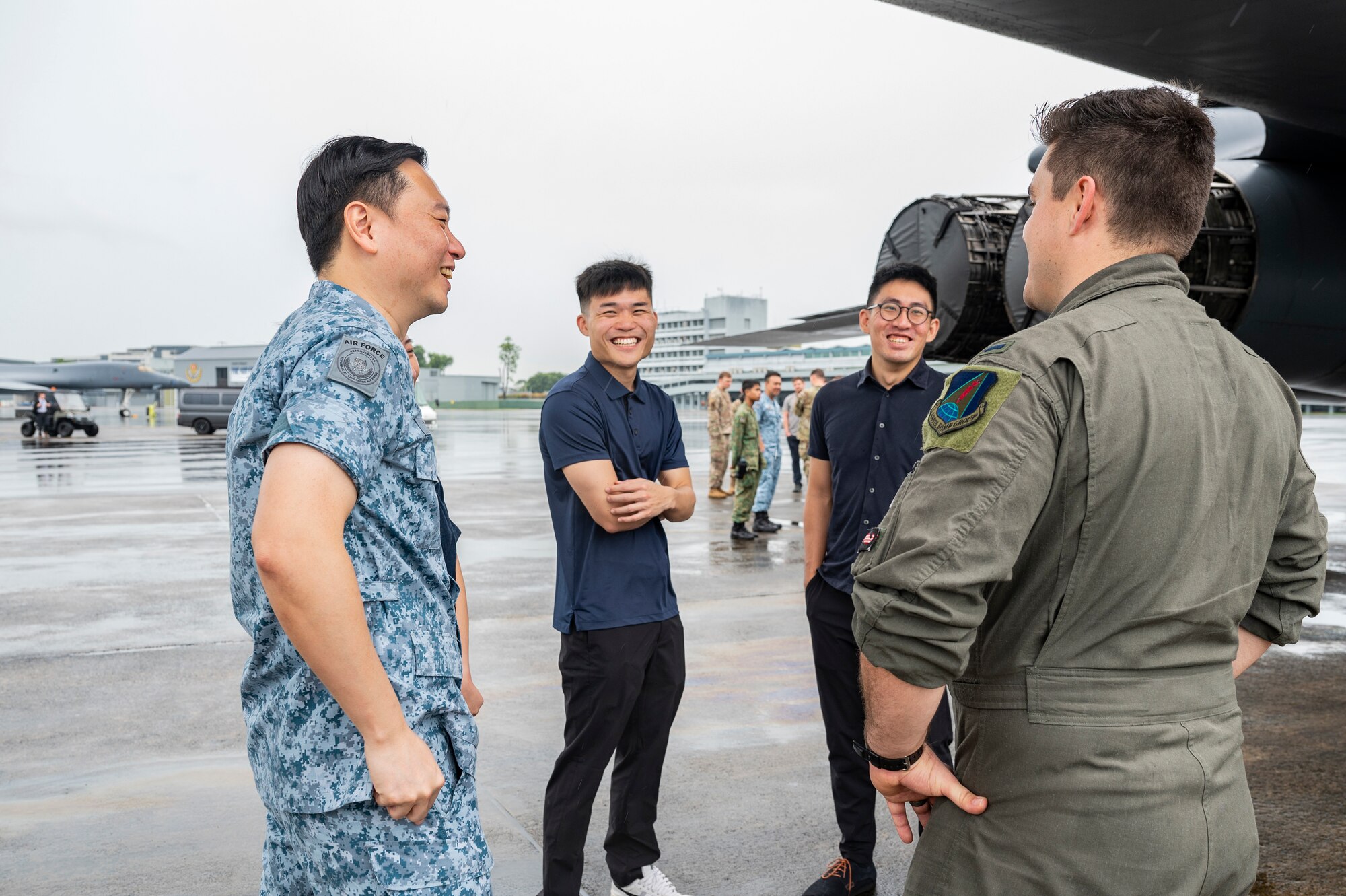 U.S. Air Force 1st Lt. Hayden Gebo, 345th Expeditionary Bomb Squadron B-1B Lancer pilot, out of Dyess Air Force Base, Texas, speaks to a group during a B-1B tour at Paya Lebar Air Base, Singapore, Jan. 20, 2024.  The U.S. Air Force’s partnership with the Republic of Singapore Air Force provides valuable professional exchanges and training opportunities with different aircraft and aircrews. (U.S. Air Force Photo by Senior Airman Ryan Hayman)