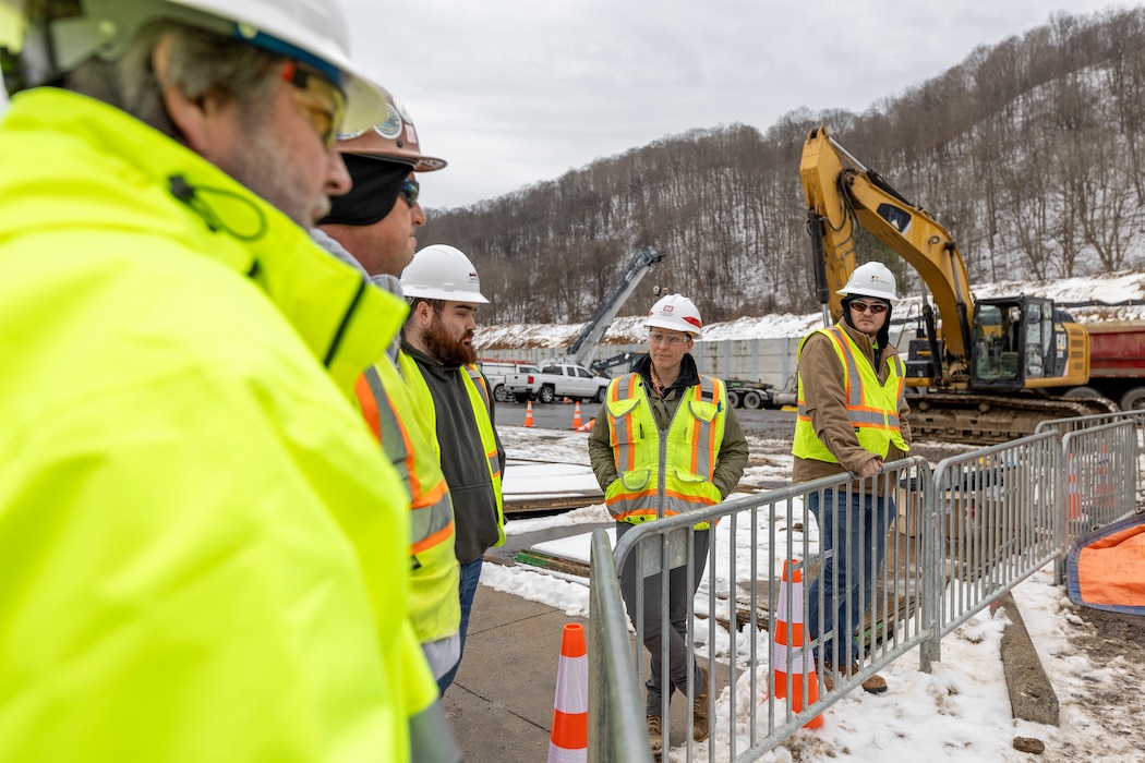 A construction crew working for the U.S. Army Corps of Engineers Pittsburgh District excavates manholes and trenches for electric lines that will provide power to a new navigation chamber at the Montgomery Locks and Dam in Monaca, Pennsylvania, Jan. 23, 2024.