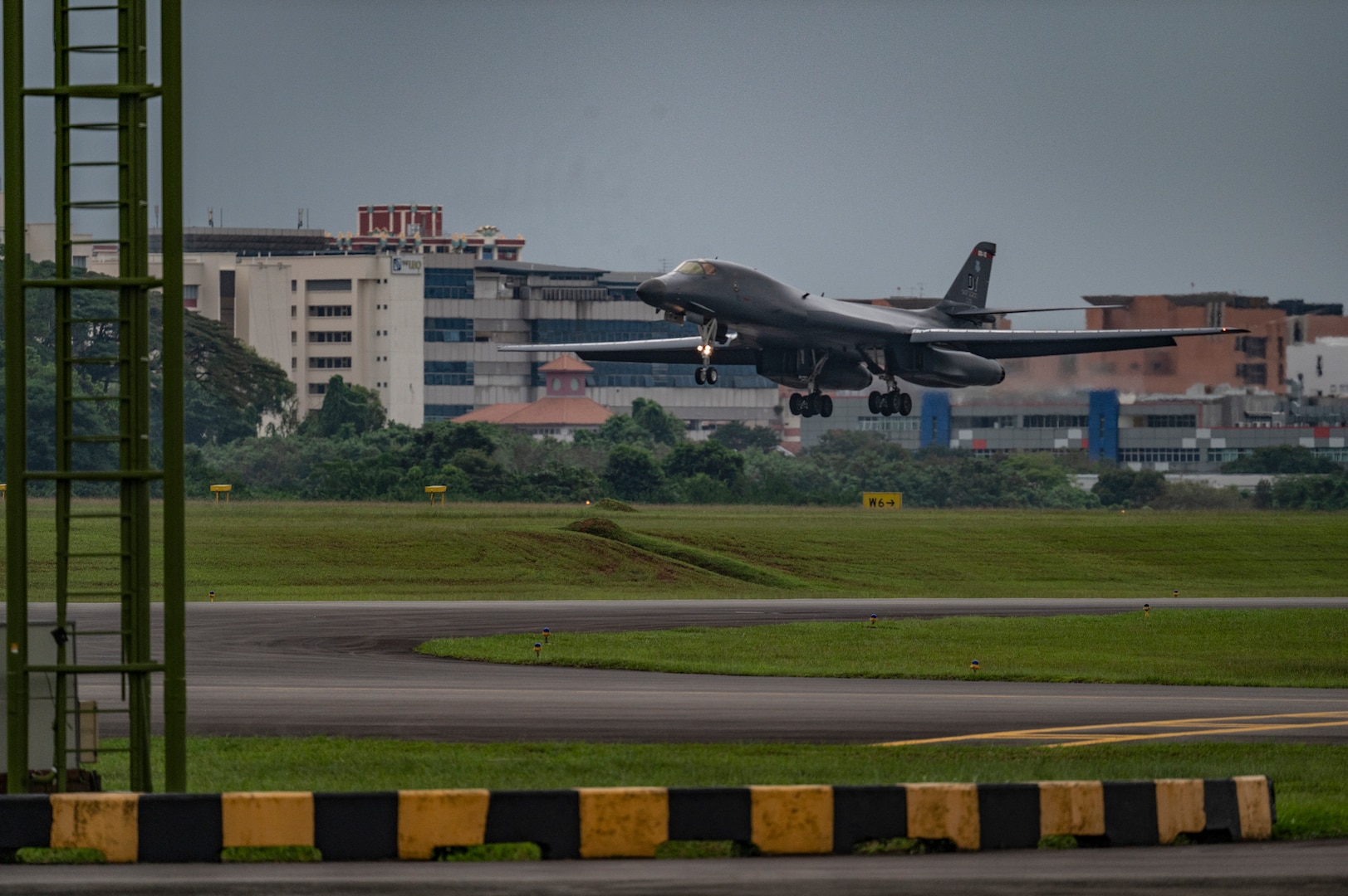 A B-1B Lancer assigned to the 345th Expeditionary Bomb Squadron, out of Dyess Air Force Base, Texas, prepares to land at Paya Lebar Air Base, Singapore, Jan. 19, 2024. The 345th EBS arrived in Singapore as part of regular U.S. Air Force training and engagements with key partners in the region. (U.S. Air Force Photo by Senior Airman Ryan Hayman)