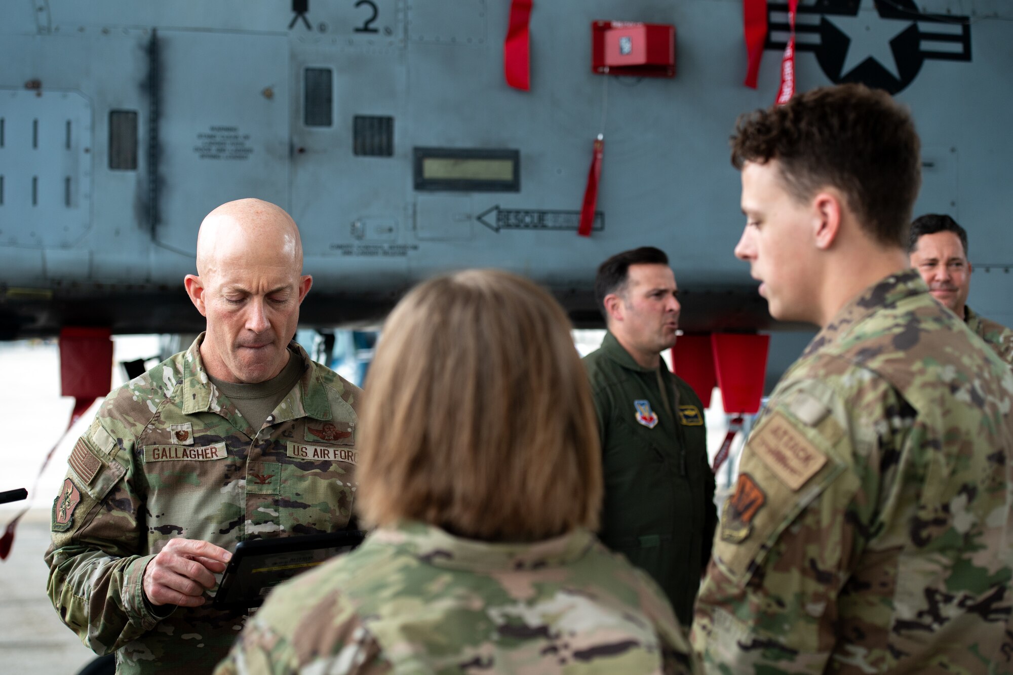 U.S. Air Force Col. Michael Gallagher, 23rd Mission Support Group commander, tests Airmen on their aircraft knowledge during a Top Tiger Competition at Moody Air Force Base, Georgia, Jan. 26th, 2024. The quarterly competition challenges dedicated crew chiefs on their capabilities and attention to detail. (U.S. Air Force photo by Airman Cade Ellis)