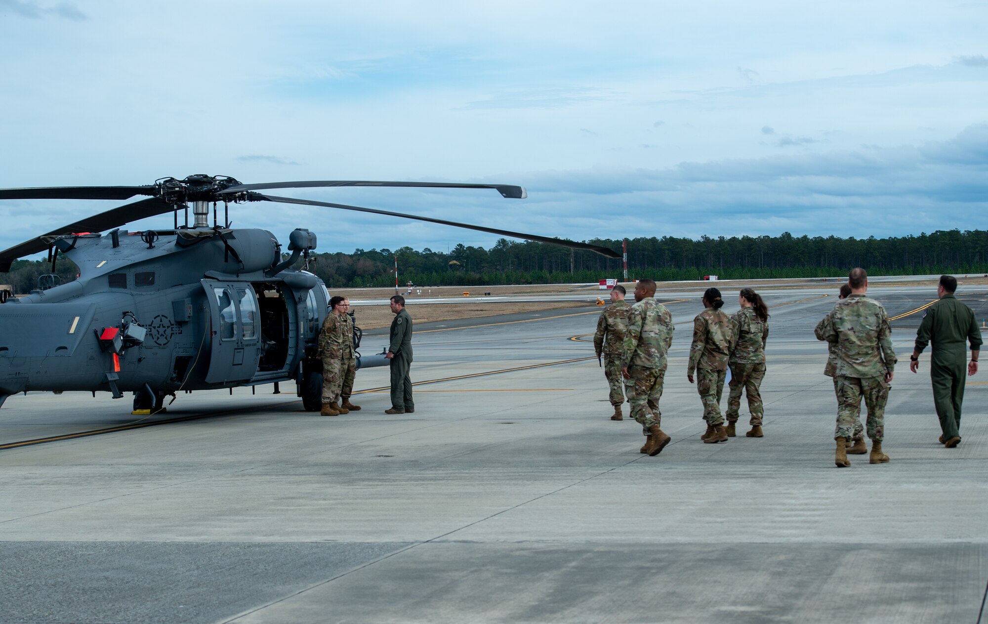 U.S. Air Force 23rd Wing leadership inspect an HH-60W Jolly Green II for the Top Tiger competition at Moody Air Force Base, Georgia, Jan. 26th, 2024. Leadership asked Airmen questions to test their aircraft knowledge and inspected each aircraft. (U.S. Air Force photo by Airman Cade Ellis)