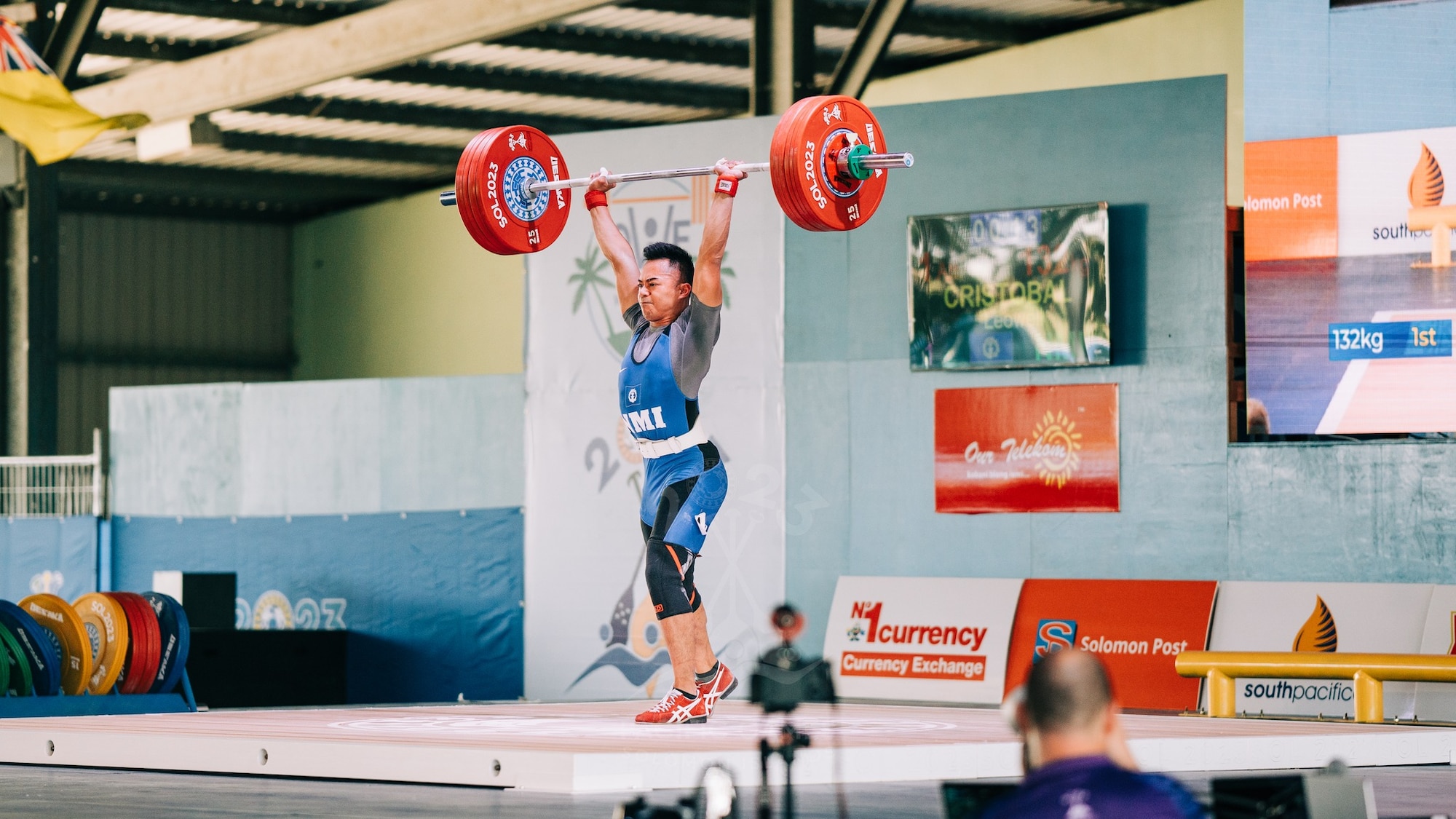 A photo of a weightlifter lifting weights