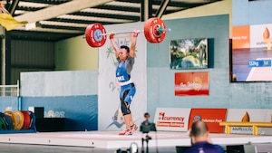 A photo of a weightlifter lifting weights