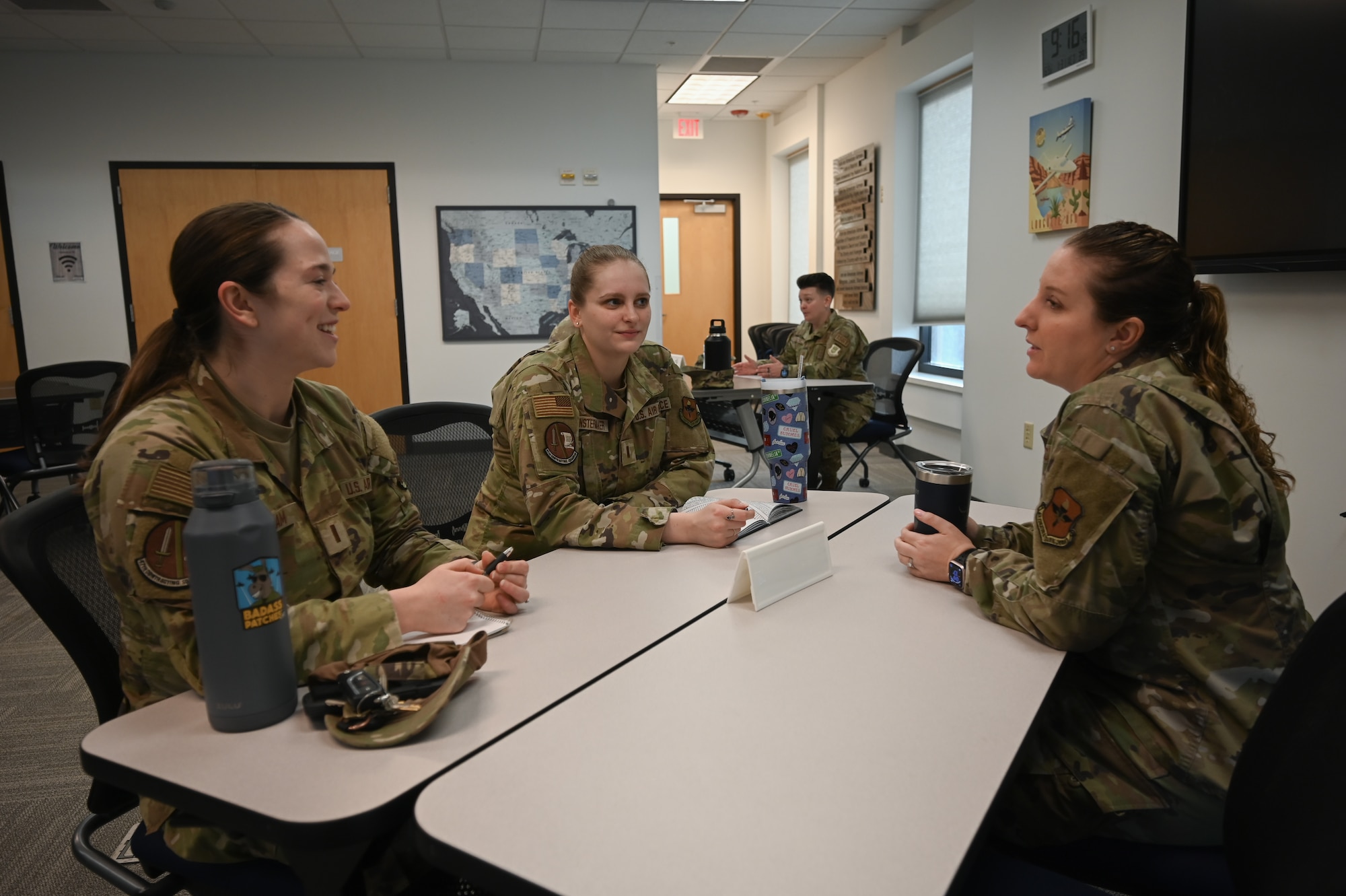 U.S. Air Force 2nd Lt. Jaine Abraham (left), 47th Contracting Squadron contracting specialist, 2nd Lt. Hayley Fenstermaker (middle), 47th CONS contracting specialist, speak with Maj. Kayleigh Stilwell (right), 47th Force Support Squadron commander, during a speed mentoring program at Laughlin Air Force Base, Texas, Jan. 31, 2023. During the mentoring event, Airmen were able to ask questions to representatives of various organizations on base in a 10 minute rotation, allowing for small groups to rotate between stations. (U.S. Air Force photo by Airman 1st Class Keira Rossman)