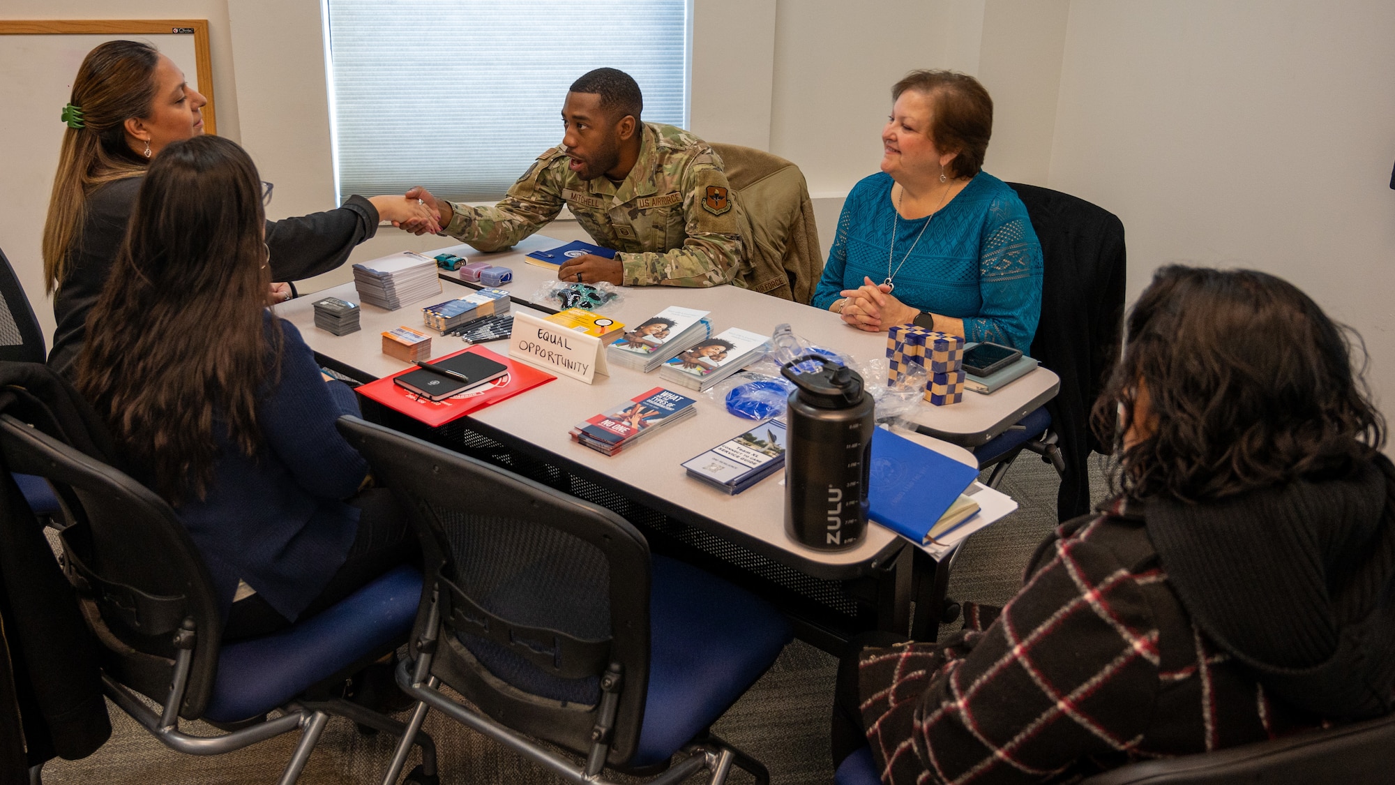 Laughlin civilian employees speak to Master Sgt. Keedrick Mitchell, 47th Flying Training Wing Equal Opportunity Office noncommissioned officer in charge, during the speed mentoring event held for civilians at Laughlin Air Force Base, Texas, Jan. 29, 2024. During the speed mentoring program attendees broke up into small groups and moved around every 10 minutes, allowing for many topics to be covered in a brief time. (U.S. Air Force photo by Staff Sgt. Nicholas Larsen)