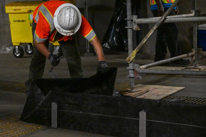 A member in support of Joint Task Force-Red Hill (JTF-RH) prepares a containment system for residual fuel removal at the Red Hill Bulk Fuel Storage Facility (RHBFSF) Jan. 22, 2024, Halawa, Hawaii.