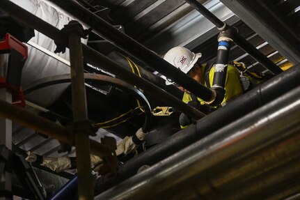A member in support of Joint Task Force-Red Hill (JTF-RH) unbolts a spectacle blind to remove residual fuel from the Red Hill Bulk Fuel Storage Facility Jan. 24, 2024, Halawa, Hawaii.