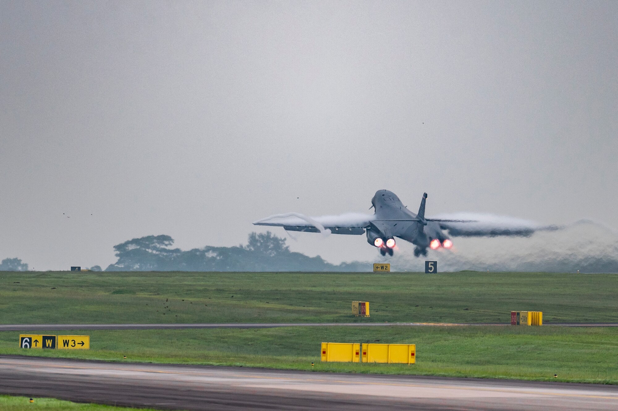 A B-1B Lancer assigned to the 345th Expeditionary Bomb Squadron, out of Dyess Air Force Base, Texas, takes off at Paya Lebar Air Base, Singapore, Jan. 24, 2024. The 345th EBS arrived in Singapore as part of regular U.S. Air Force training and engagements with key partners in the region. (U.S. Air Force photo by Senior Airman Ryan Hayman)
