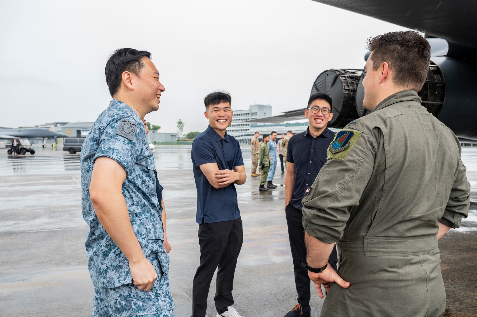 U.S. Air Force 1st Lt. Hayden Gebo, 345th Expeditionary Bomb Squadron B-1B Lancer pilot, out of Dyess Air Force Base, Texas, speaks to a group during a B-1B tour at Paya Lebar Air Base, Singapore, Jan. 20, 2024.  The U.S. Air Force’s partnership with the Republic of Singapore Air Force provides valuable professional exchanges and training opportunities with different aircraft and aircrews. (U.S. Air Force Photo by Senior Airman Ryan Hayman)
