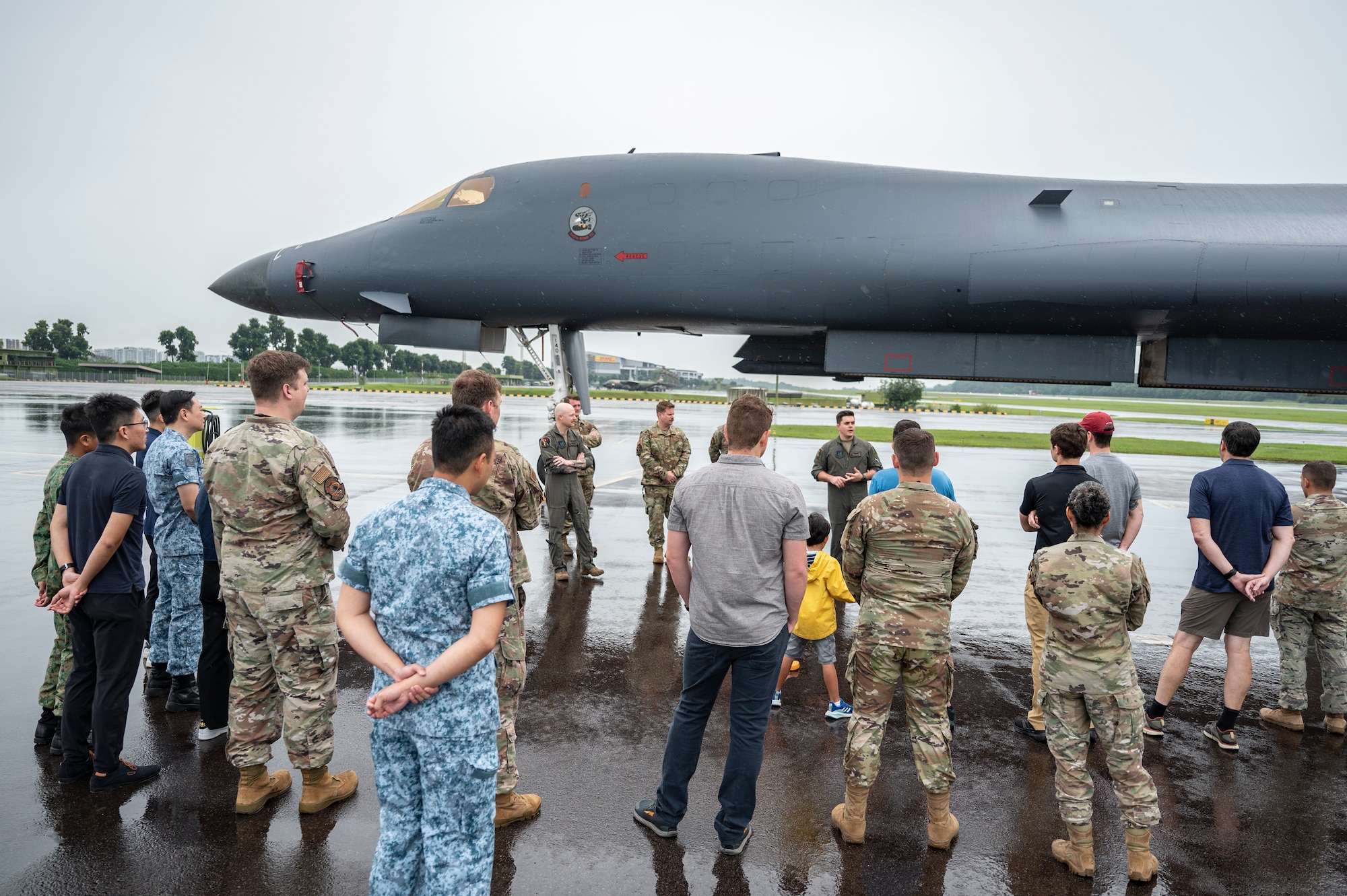 U.S. Air Force members from the 345th Expeditionary Bomb Squadron, out of Dyess Air Force Base, Texas, give a B-1B Lancer tour at Paya Lebar Air Base, Singapore, Jan. 20, 2024. The U.S. Air Force’s partnership with the Republic of Singapore Air Force provides valuable professional exchanges and training opportunities with different aircraft and aircrews. (U.S. Air Force Photo by Senior Airman Ryan Hayman)