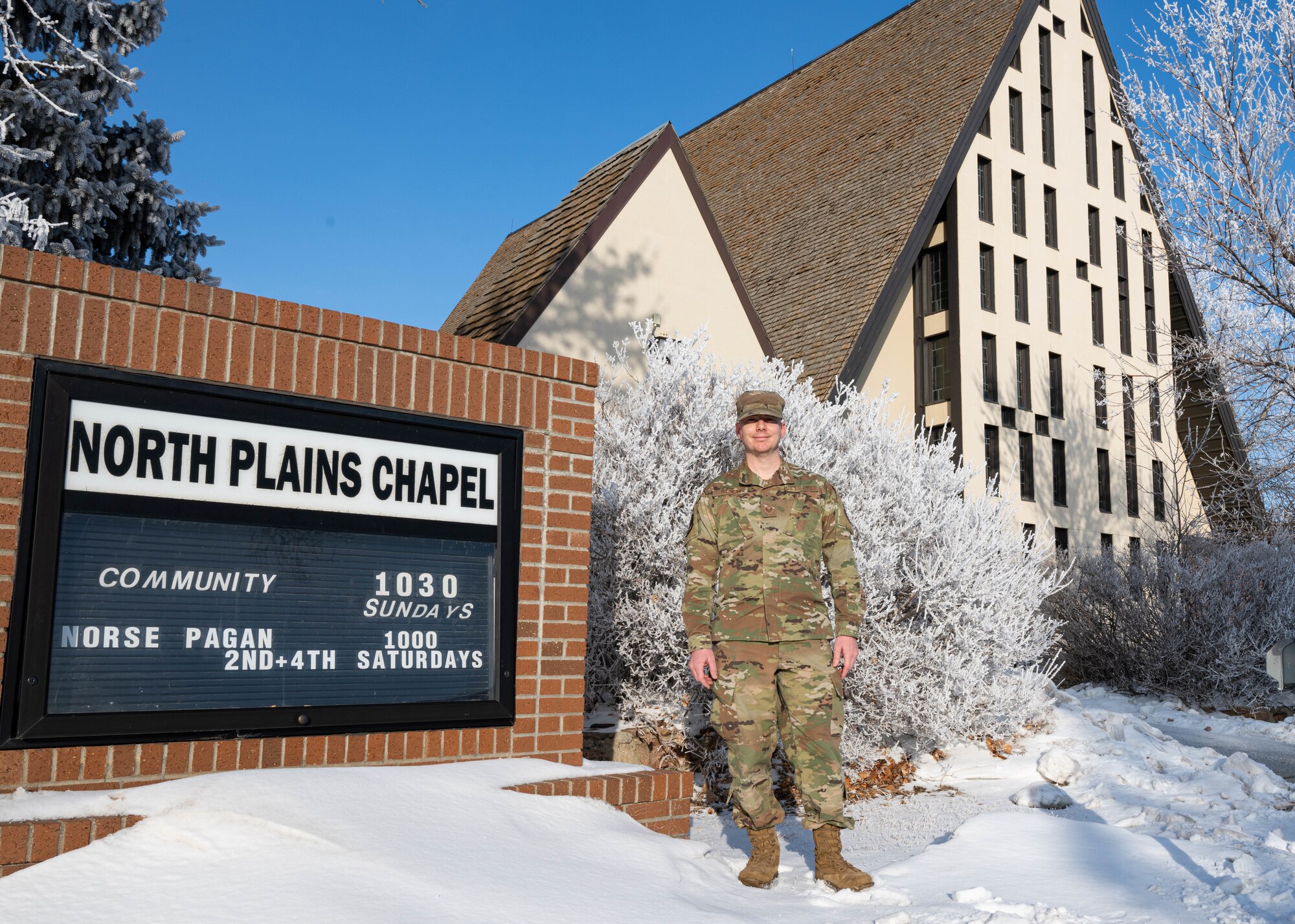 U.S. Air Force Staff Sgt. Daniel Starr, chapel augmentee flight NCOIC, poses for a photo outside the North Plains Chapel at Minot Air Force Base, North Dakota, Jan. 25, 2024. Starr was recently selected to attend Air Force Officer Training School to commission as a chaplain. (U.S. Air Force photo by Airman 1st Class Kyle Wilson)