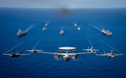 PHILIPPINE SEA (Jan. 31, 2024) Aircraft assigned to Carrier Air Wing (CVW) 2, fly in formation during multi large deck event (MLDE) held in the Philippine Sea, Jan. 31. MLDE provides the U.S. Navy and Japan Maritime Self Defense force an opportunity to engage in joint operations to include enhanced maritime communication operations, air warfare operations and cross-deck flight operations to strengthen maritime integrated-at-sea operations and combat readiness. (U.S. Navy photo)