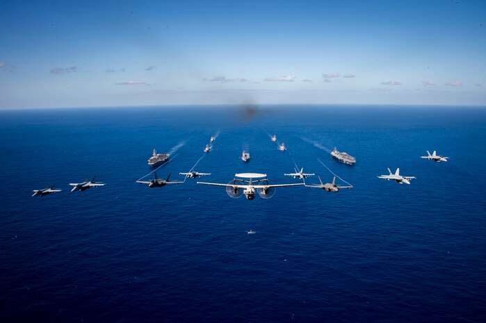 PHILIPPINE SEA (Jan. 31, 2024) Aircraft assigned to Carrier Air Wing (CVW) 2, fly in formation during multi large deck event (MLDE) held in the Philippine Sea, Jan. 31. MLDE provides the U.S. Navy and Japan Maritime Self Defense force an opportunity to engage in joint operations to include enhanced maritime communication operations, air warfare operations and cross-deck flight operations to strengthen maritime integrated-at-sea operations and combat readiness. (U.S. Navy photo)