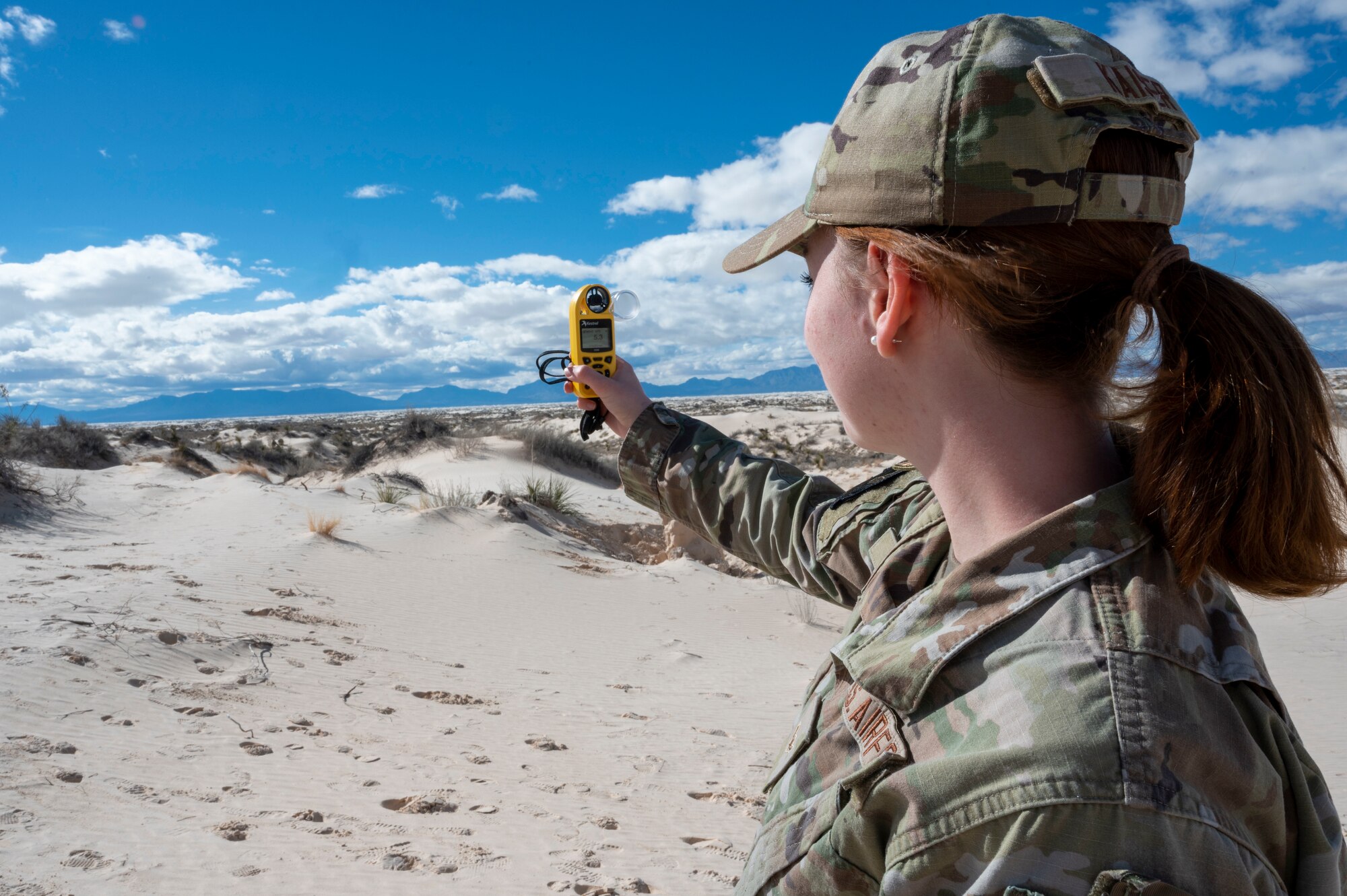 U.S. Air Force Airman Melody Kaiser, 54th Operations Support Squadron weather apprentice, takes meteorological measurements during an exercise at Holloman Air Force Base, New Mexico, Jan. 22, 2024. The 54th OSS provides the base with past, present and future weather observations that are crucial to providing the surrounding squadrons and units with air superiority. (U.S Air Force photo by Airman 1st Class Isaiah Pedrazzini)
