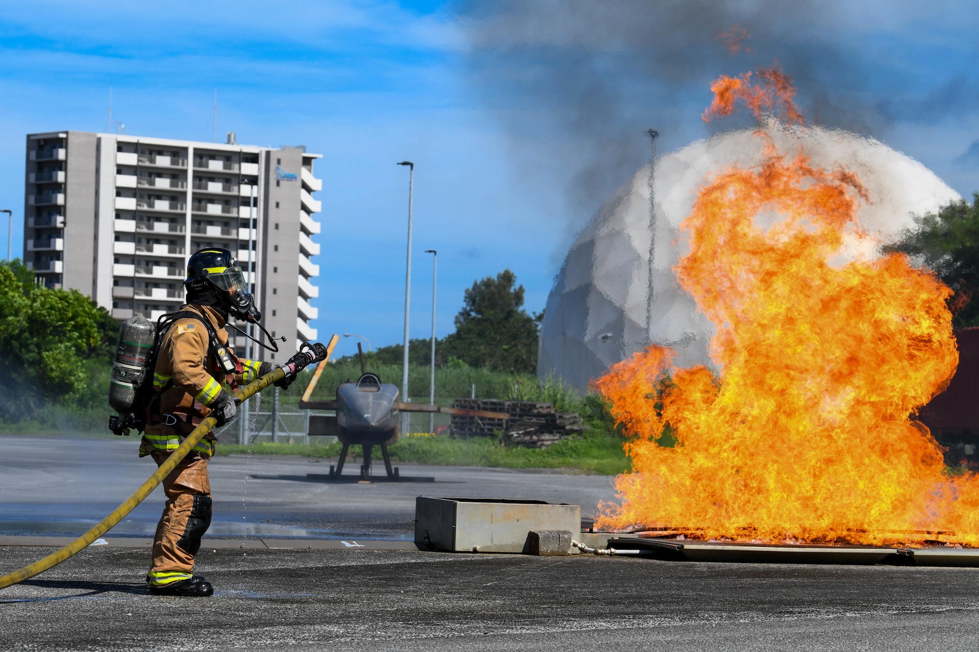 Kadena firefighter fights a roaring simulated oil fire