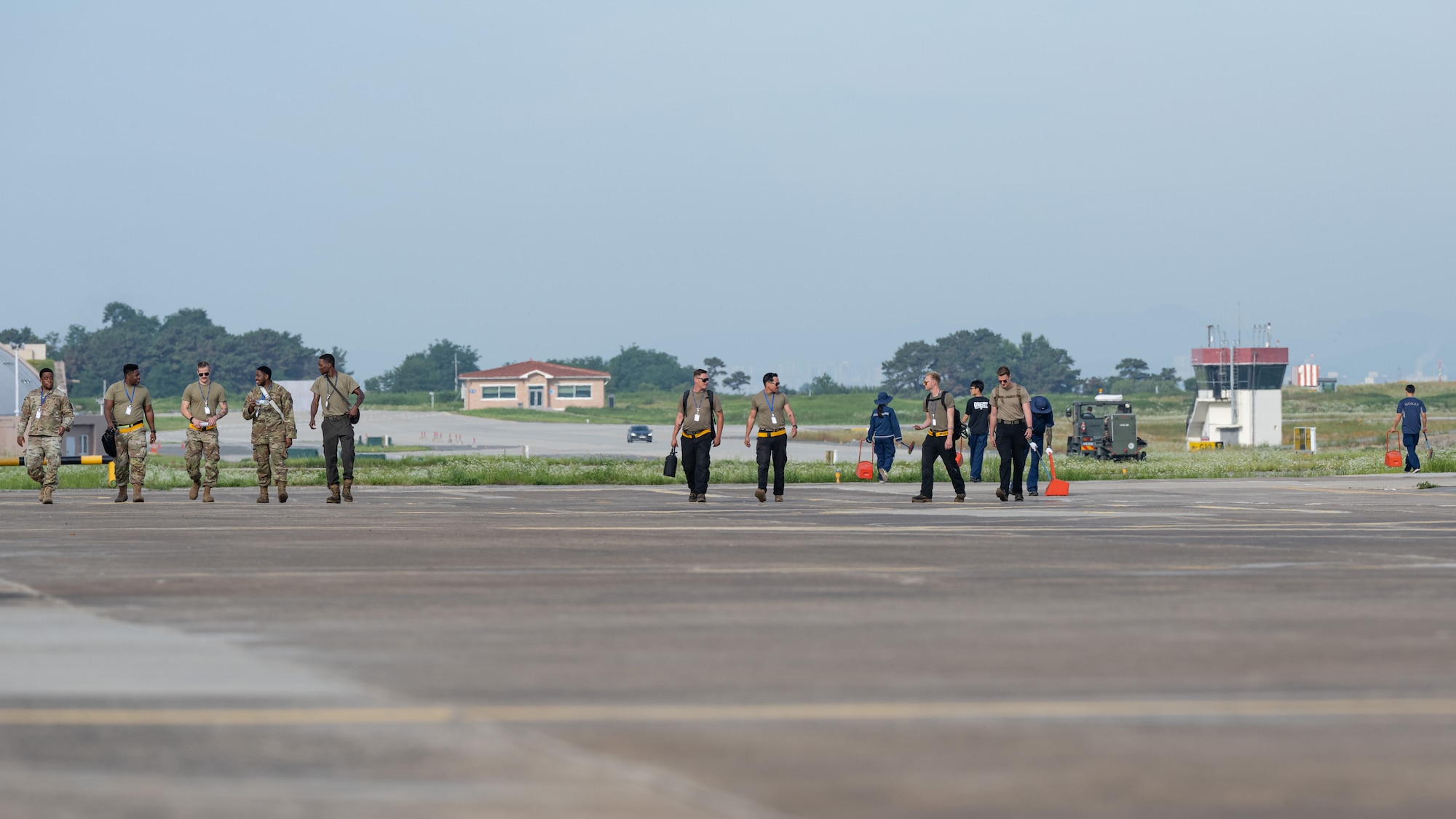Airmen from the 80th Fighter Generation Squadron and Republic of Korea Air Force perform a foreign object debris walk during Buddy Squadron 24-4 at Cheongju Air Base, Republic of Korea.