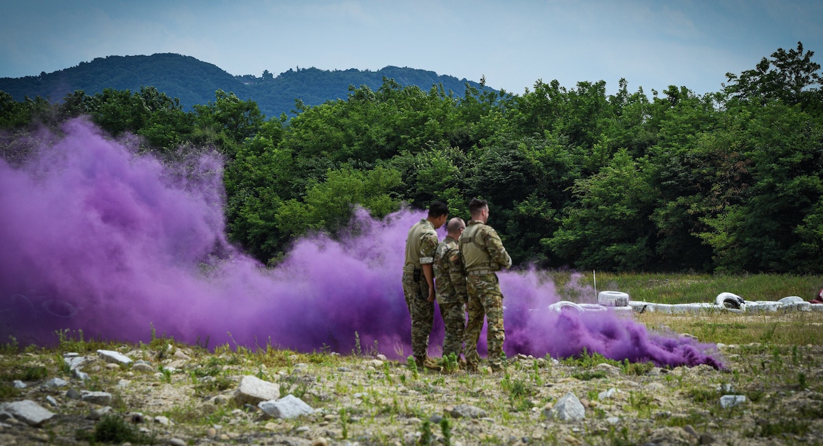 Members of the 607th Air Support Operations Group mark the end of combined Republic of Korea and U.S. cargo drop training operations with purple smoke at a designated landing zone near Yeoju, Republic of Korea.