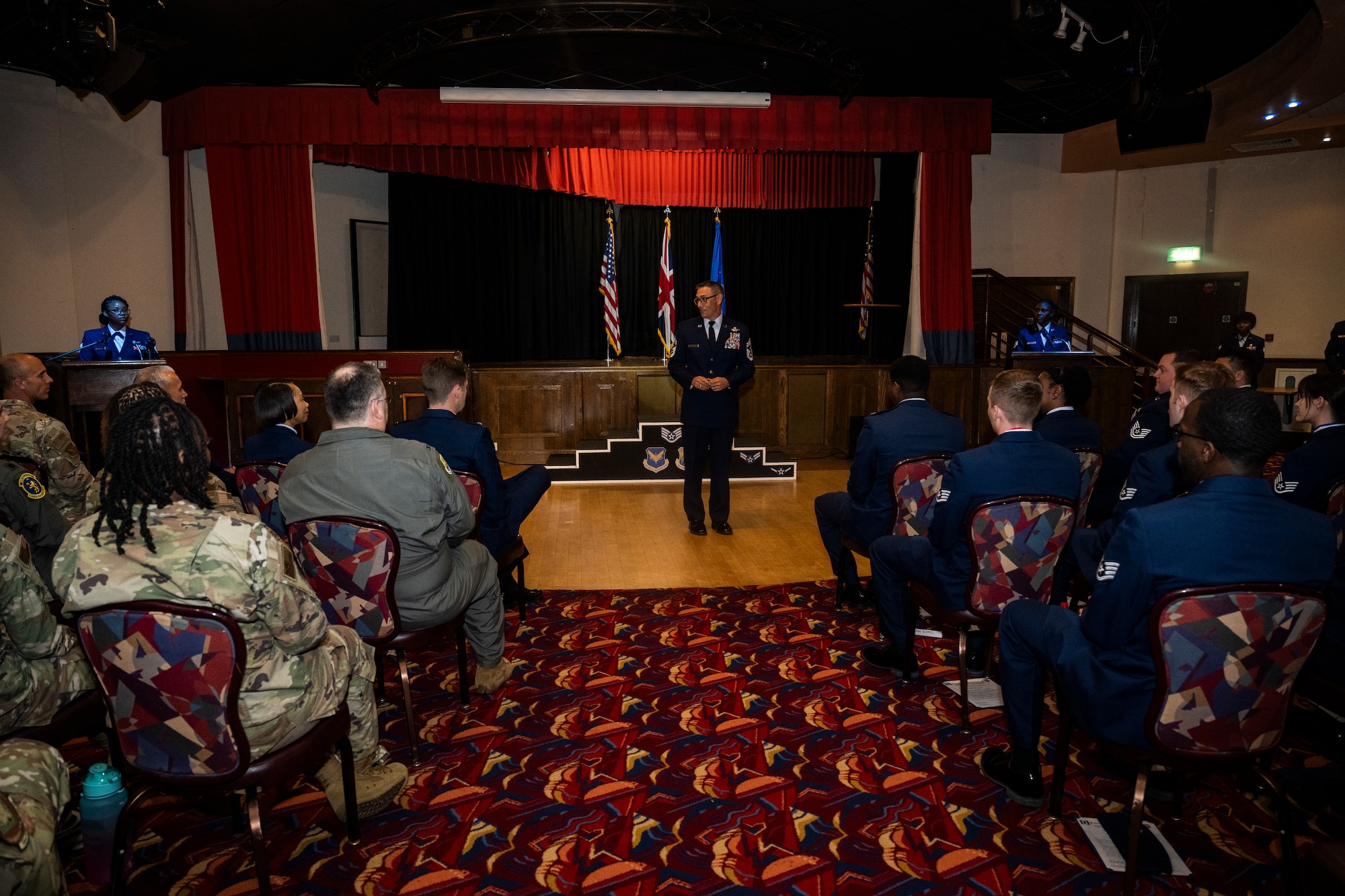 U.S. Air Force Chief Master Sgt. Celestino Madrid, 352d Special Operations Wing command chief, speaks during a noncommissioned officer induction ceremony at Royal Air Force Mildenhall, England, June 27, 2024.