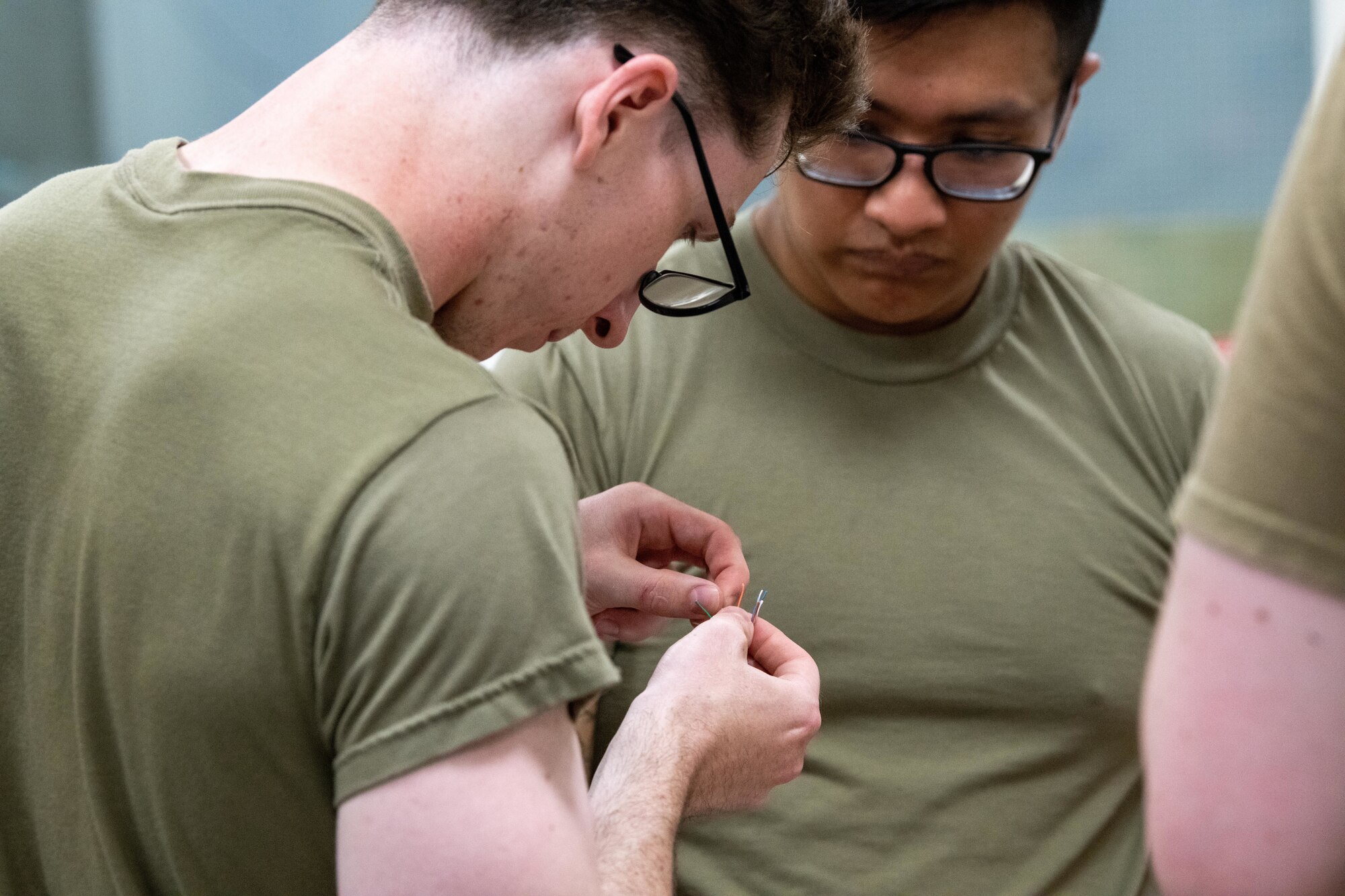Airmen create a category 6 cable during a Tiger Challenge