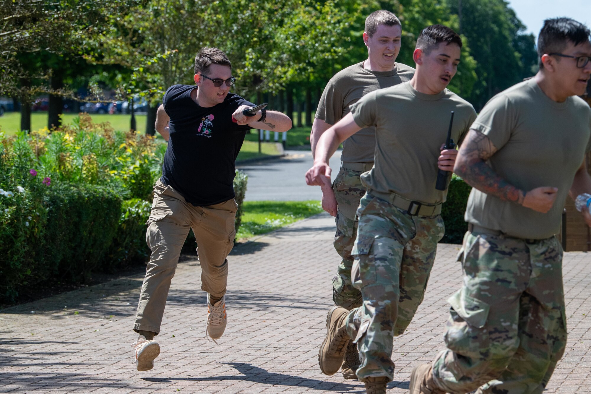 Airmen run from a fake attack