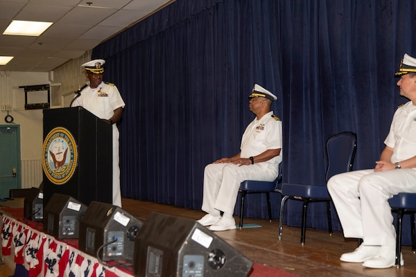 DIEGO GARCIA, British Indian Ocean Territory – Cmdr. Clifton Butler, outgoing officer in charge at Naval Medical Readiness Training Unit (NMRTU) Diego Garcia, speaks in front of Capt. Richard Gilliard, executive officer of U.S. Navy Medicine Readiness and Training Command Yokosuka Japan, and Cmdr. Kenneth Jenkins, incoming officer in charge for NMRTU Diego Garcia, during the NMRTU Diego Garcia change of charge ceremony onboard NSF Diego Garcia June 24, 2024. NSF Diego Garcia’s mission is to provide critical support to U.S. and allied forces forward deployed to the Indian Ocean, while supporting multi-theater forces operating in the CENTCOM, AFRICOM, EUCOM and PACOM areas of responsibilities in support of overseas contingency operations. (Courtesy photo by Nengh Dumlao)